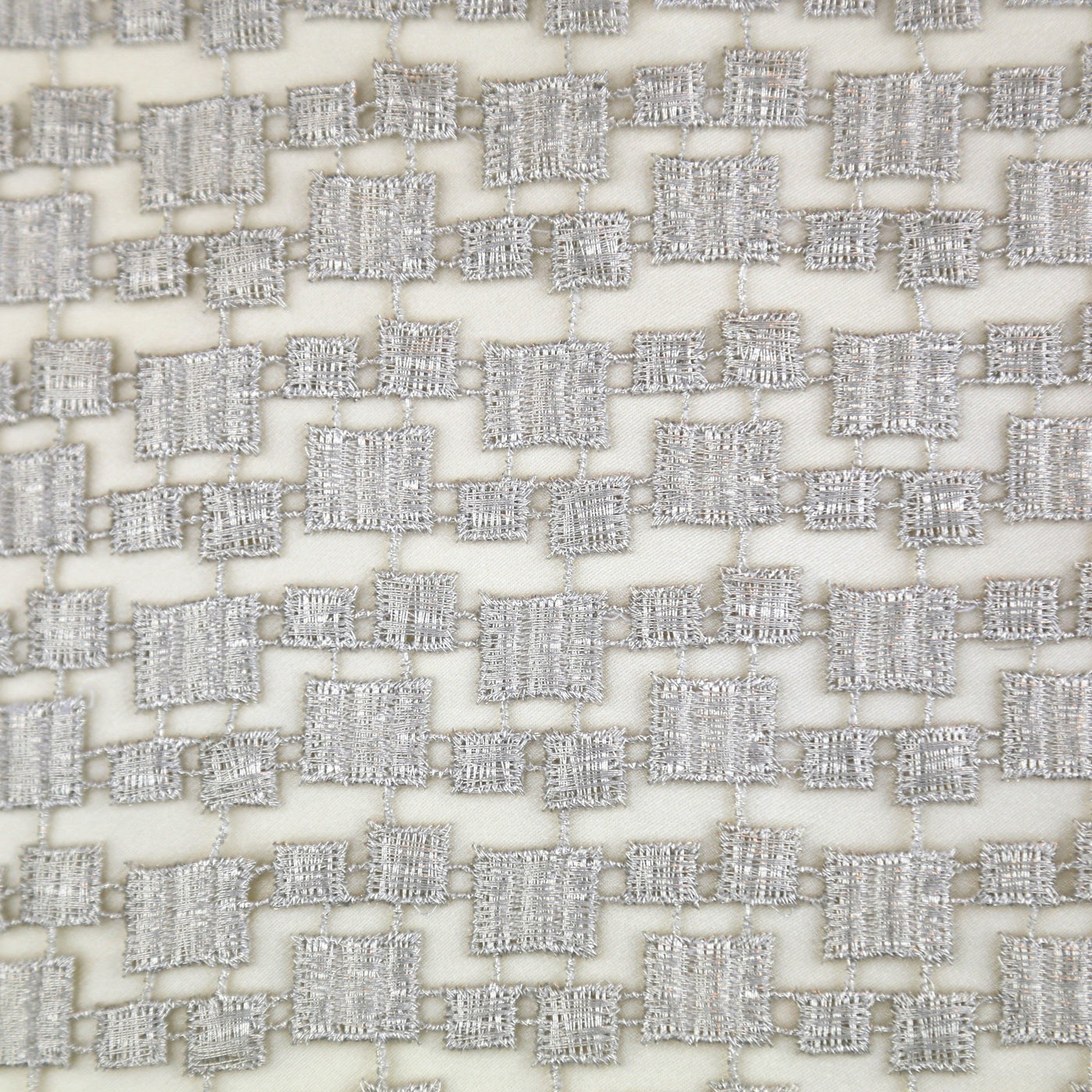 Ann Gish Metallic Mosaic pillow, ivory ground with silver woven square geometric pattern.