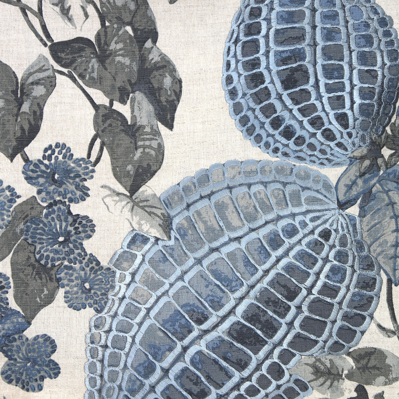 Close-up of Ann Gish Nature duvet cover, blue botanical print on ivory linen.