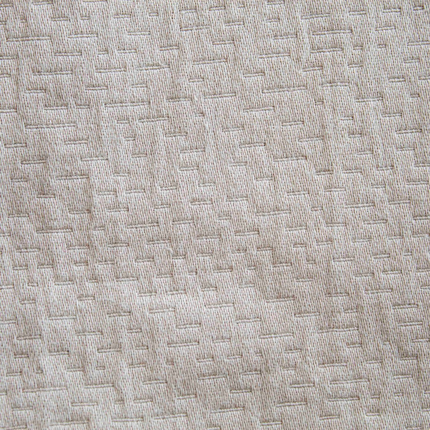 Close-up of Ann Gish Neo duvet in ivory, showing woven geometric basket-weave texture.