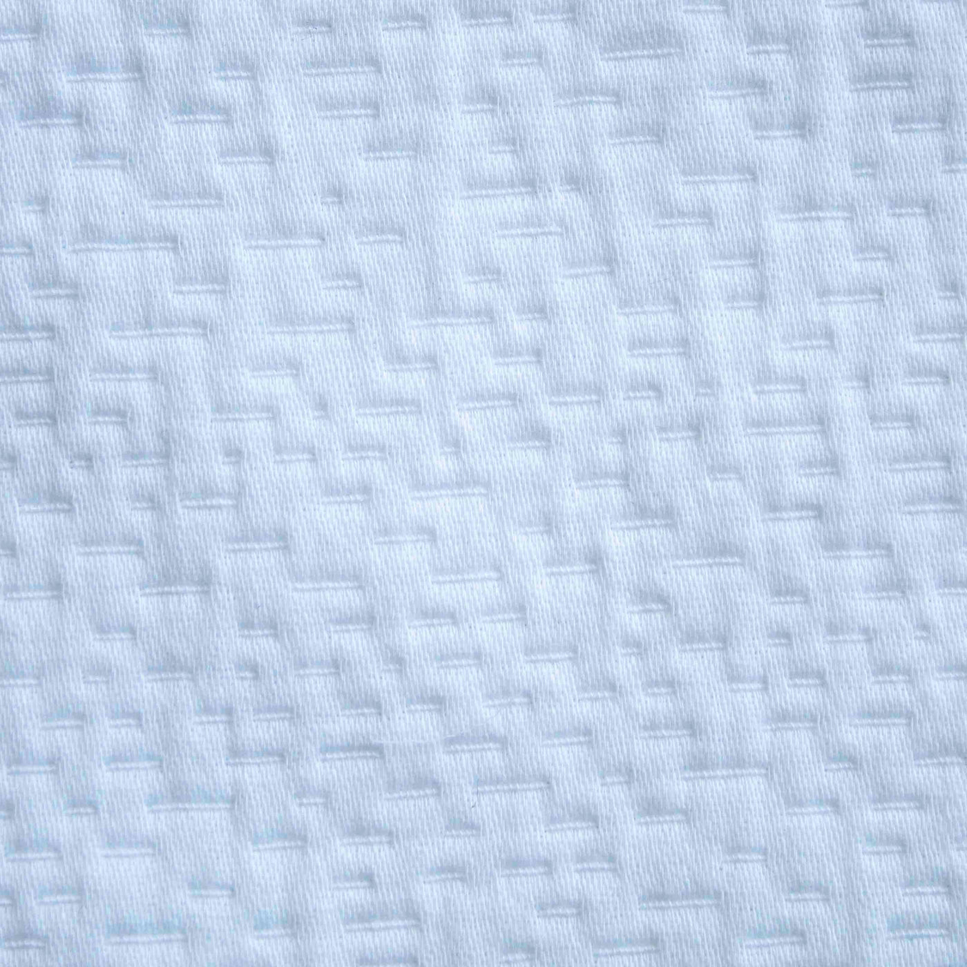 Close-up of Ann Gish Neo duvet set in pale blue with geometric woven texture detail.