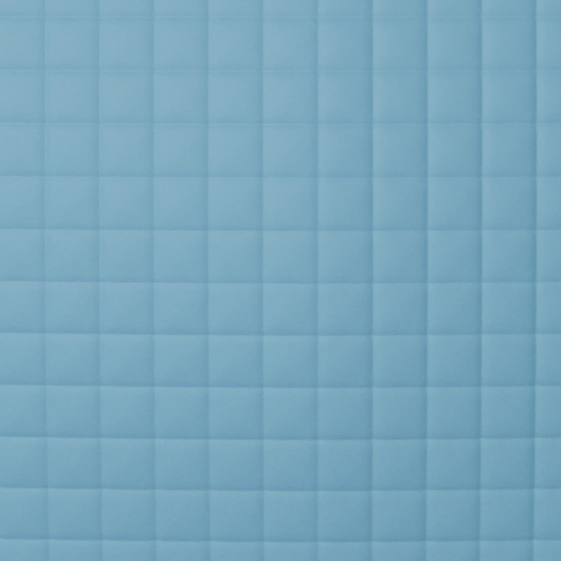 Close-up of Ann Gish Ready-to-Bed 2.0 quilted coverlet in sky blue square-grid pattern.