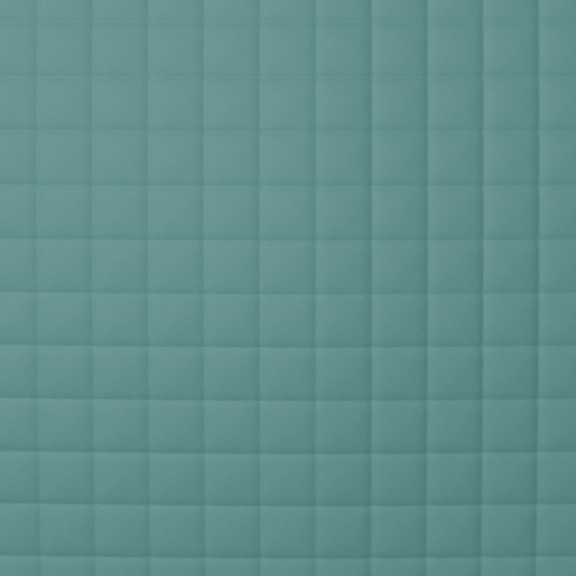 Close-up of Ann Gish Ready-to-Bed 2.0 quilted coverlet in teal, showing grid-stitched quilting pattern.