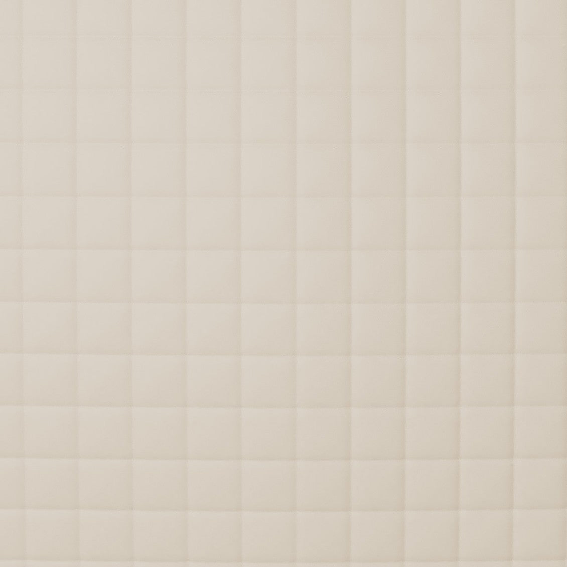 Close-up of Ann Gish Ready-to-Bed 2.0 coverlet showing ivory quilted grid stitching detail.