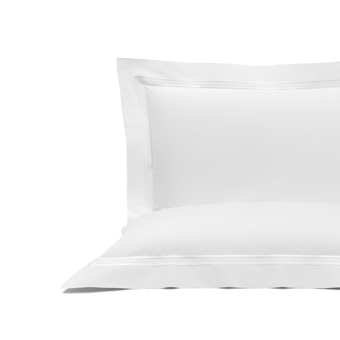 The Triplo Bourdon | Pillow Sham by Frette is a white cotton poplin pillowcase with a double-stitched border, shown on a plain white background.