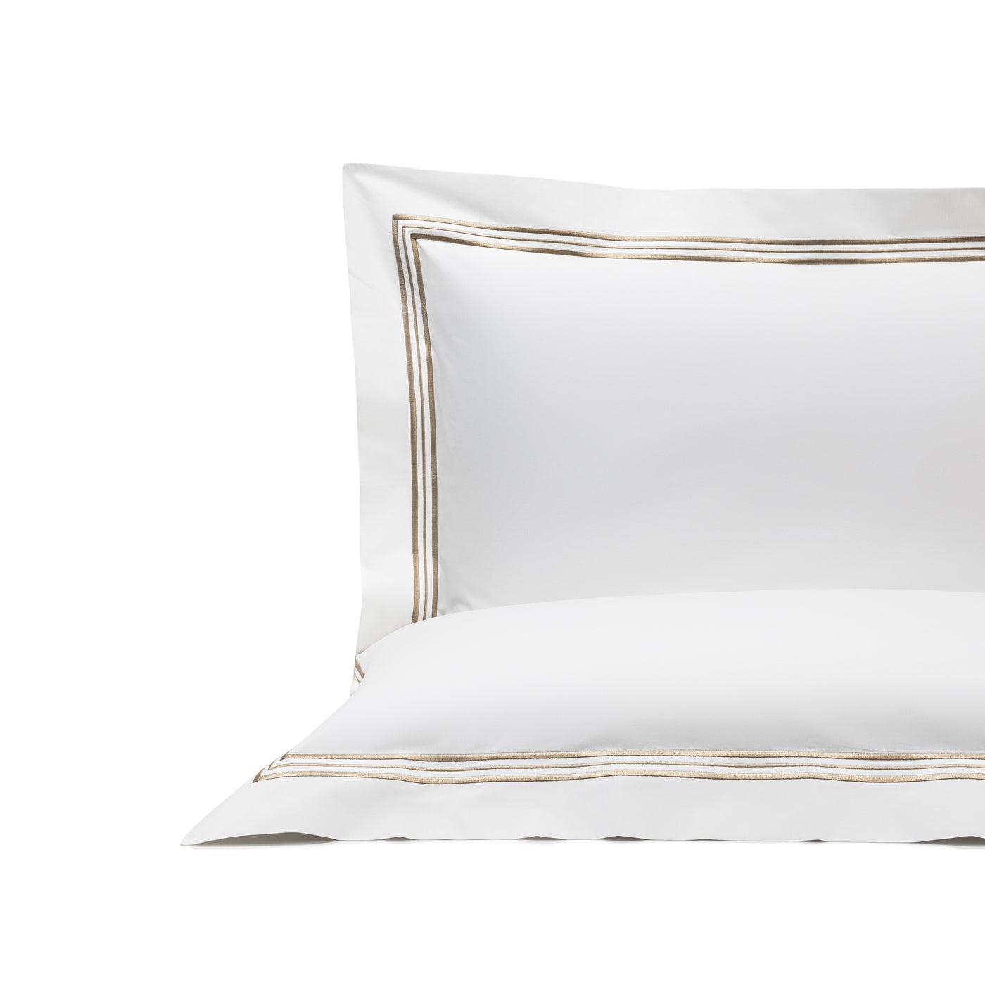 The Frette Triplo Bourdon Pillow Sham is a white pillowcase featuring elegant triple gold embroidered lines, shown on a plain white background.
