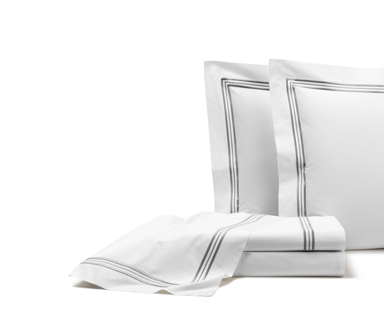 The Triplo Bourdon Sheet Set by Frette features white cotton poplin bedding with two pillows and a folded sheet, all accented by a simple double-line gray border design.