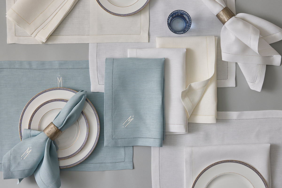 Elevate your tabletop with Matouk’s Valentina Hemstitch Placemat Set, featuring sumptuous linen placemats and napkins with a delicate hemstitch border—perfect for elegant dining.