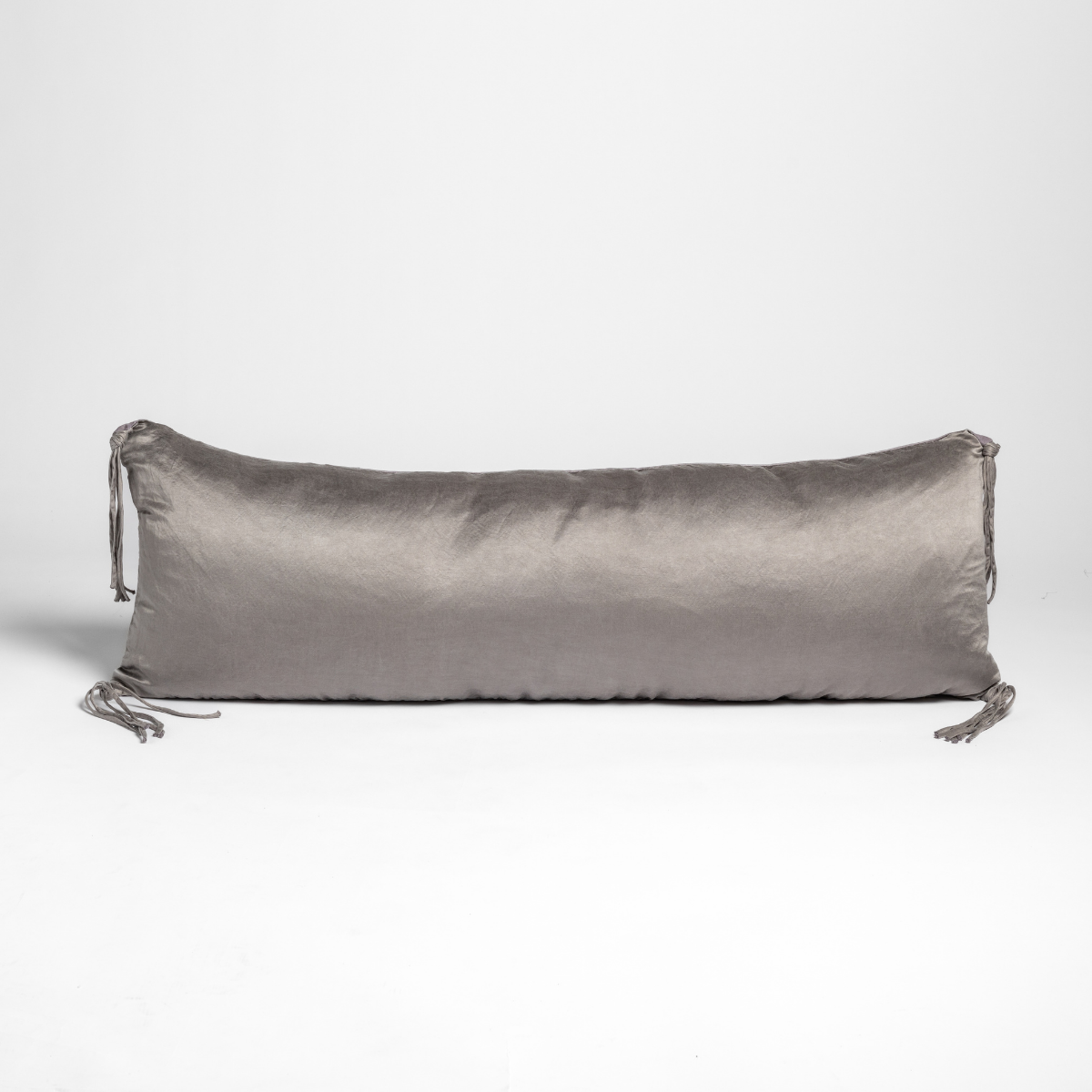 Bella Notte Taline bolster pillow in French Lavender with tassel ties at each end.