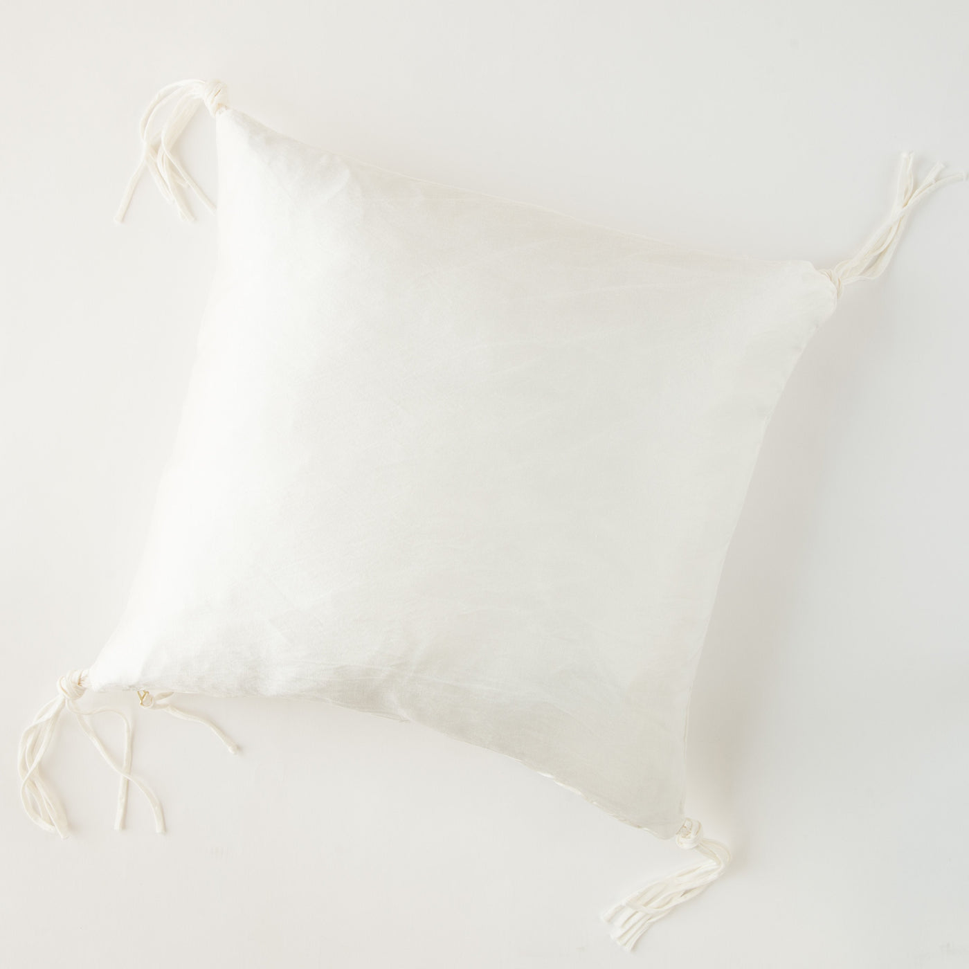 Bella Notte Taline throw pillow in Winter White with decorative corner tie details.