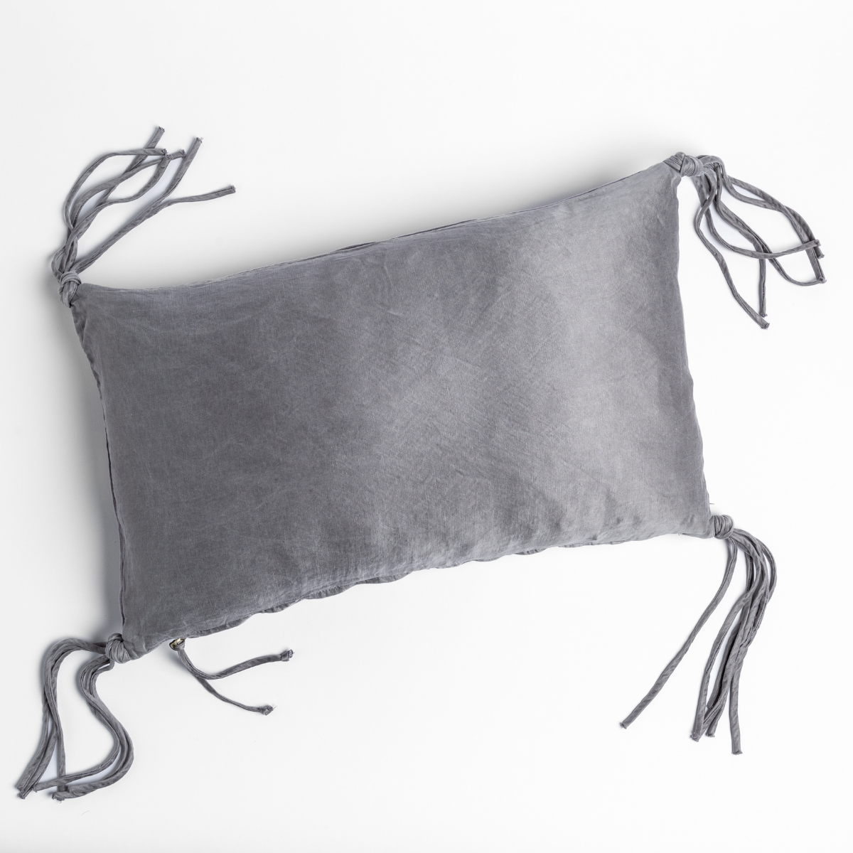 Corner tie detail on Bella Notte Taline throw pillow in French Lavender linen.