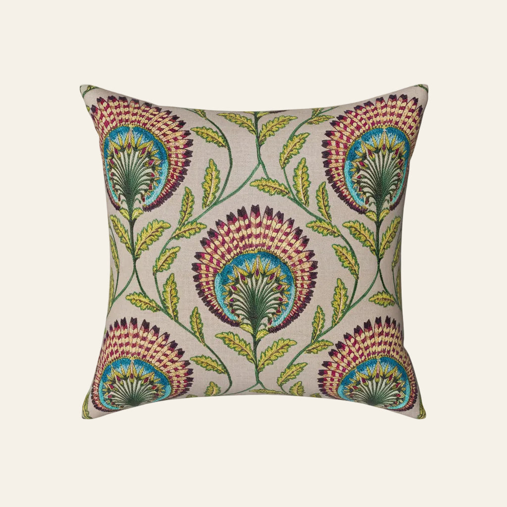 Ann Gish Tavus pillow with multicolor embroidered peacock fan floral motif on ivory linen.