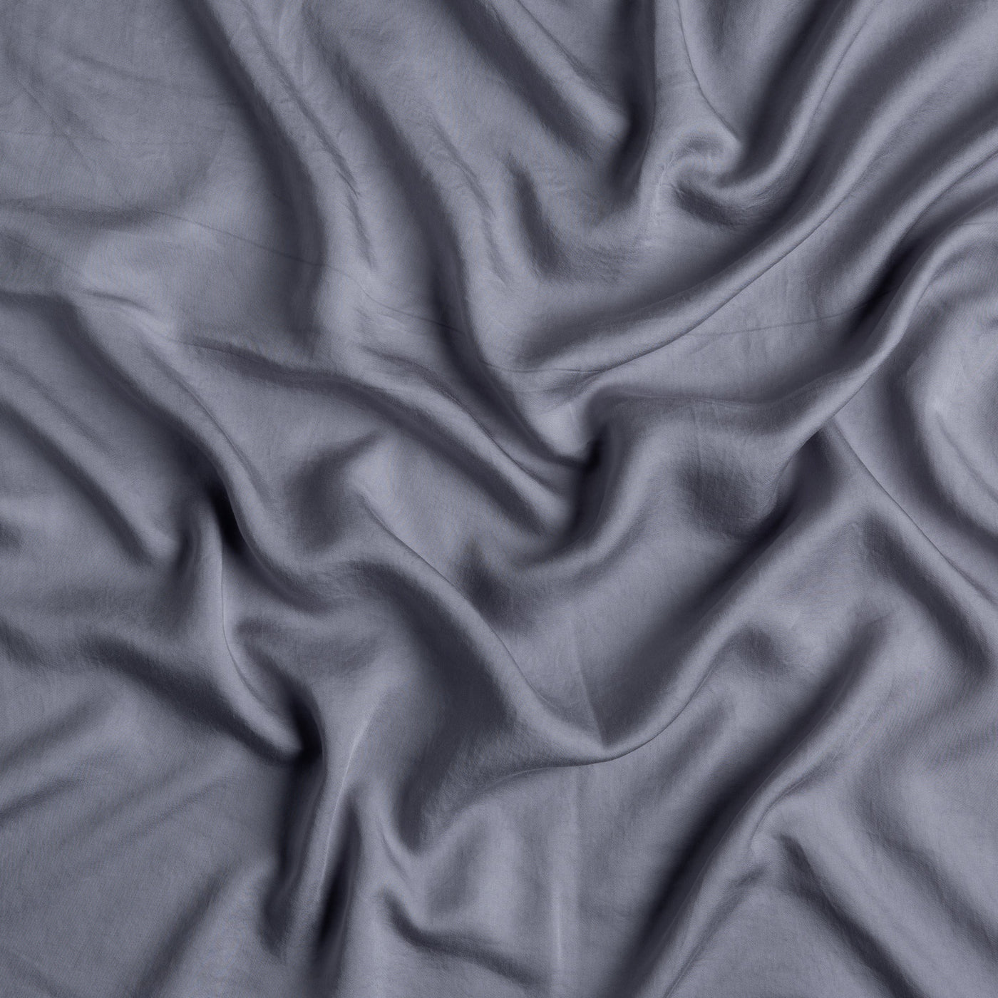 Close-up of French Lavender Madera Luxe fitted sheet fabric with soft draped folds.