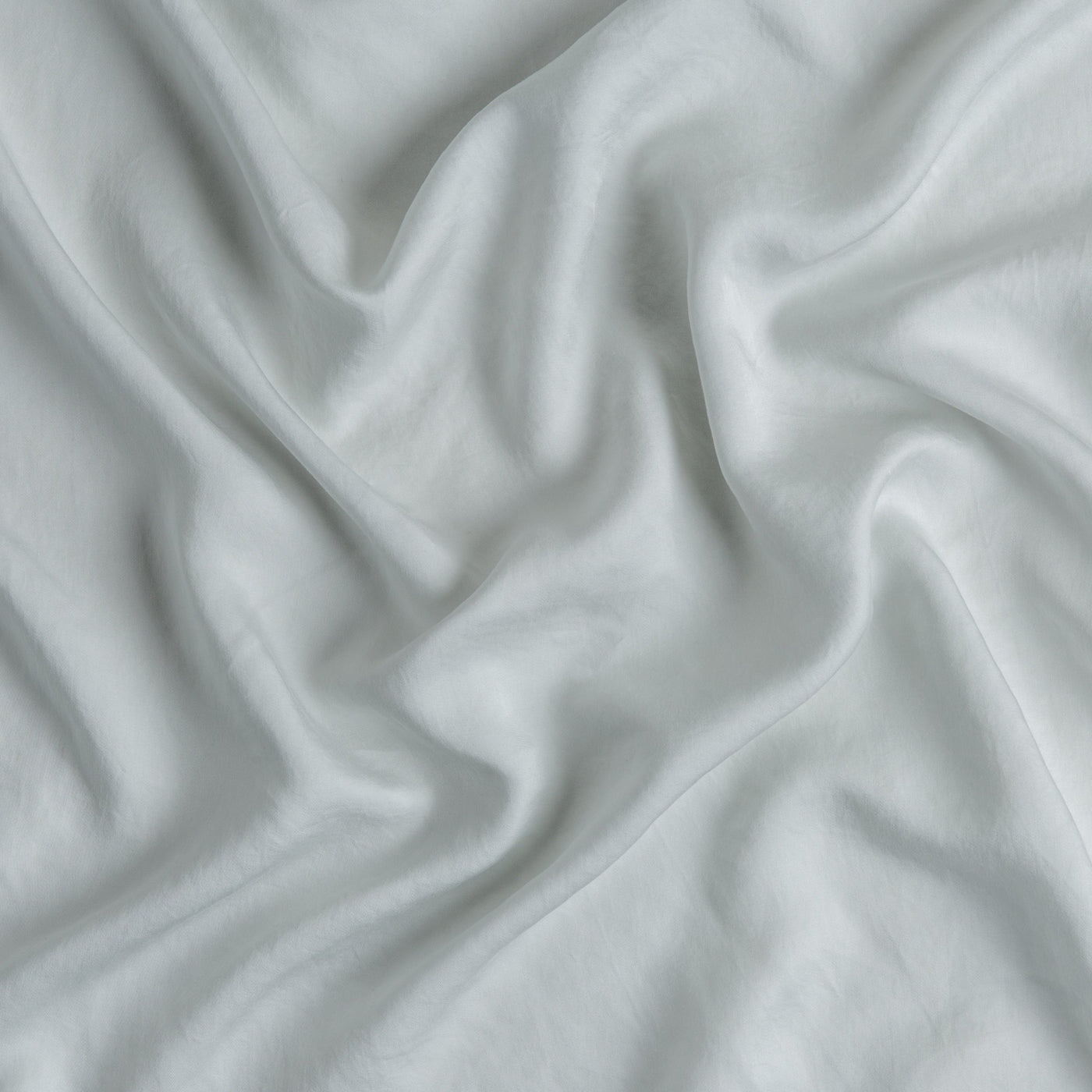 Softly draped Cloud Madera Luxe fabric showing silky texture and gentle folds.