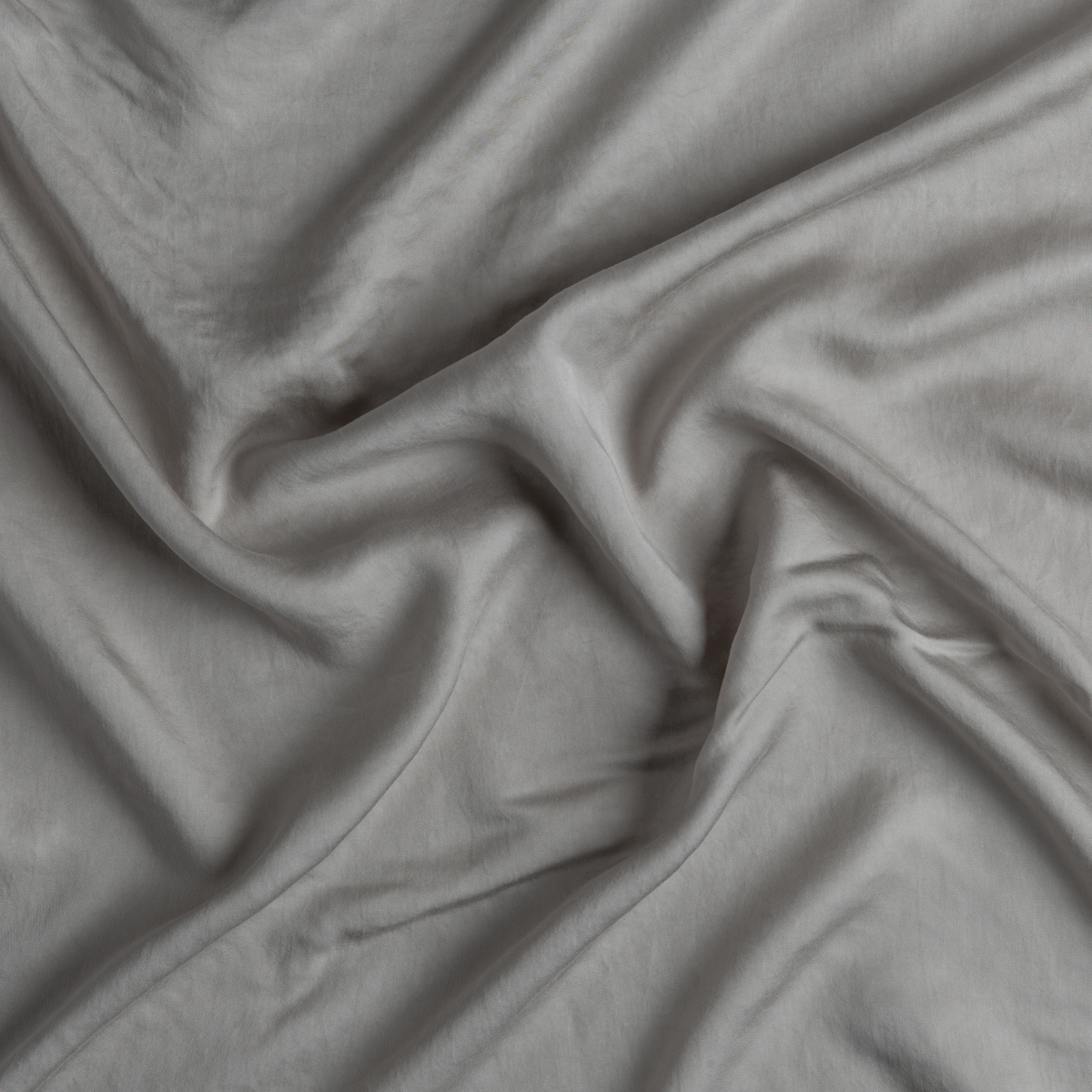 Softly draped Fog Madera Luxe fabric showing smooth, silky texture with gentle folds.