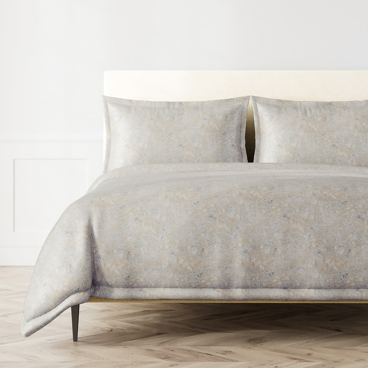 Ann Gish Terrazzo duvet set in silver-grey with subtle mottled texture, styled on a bed.