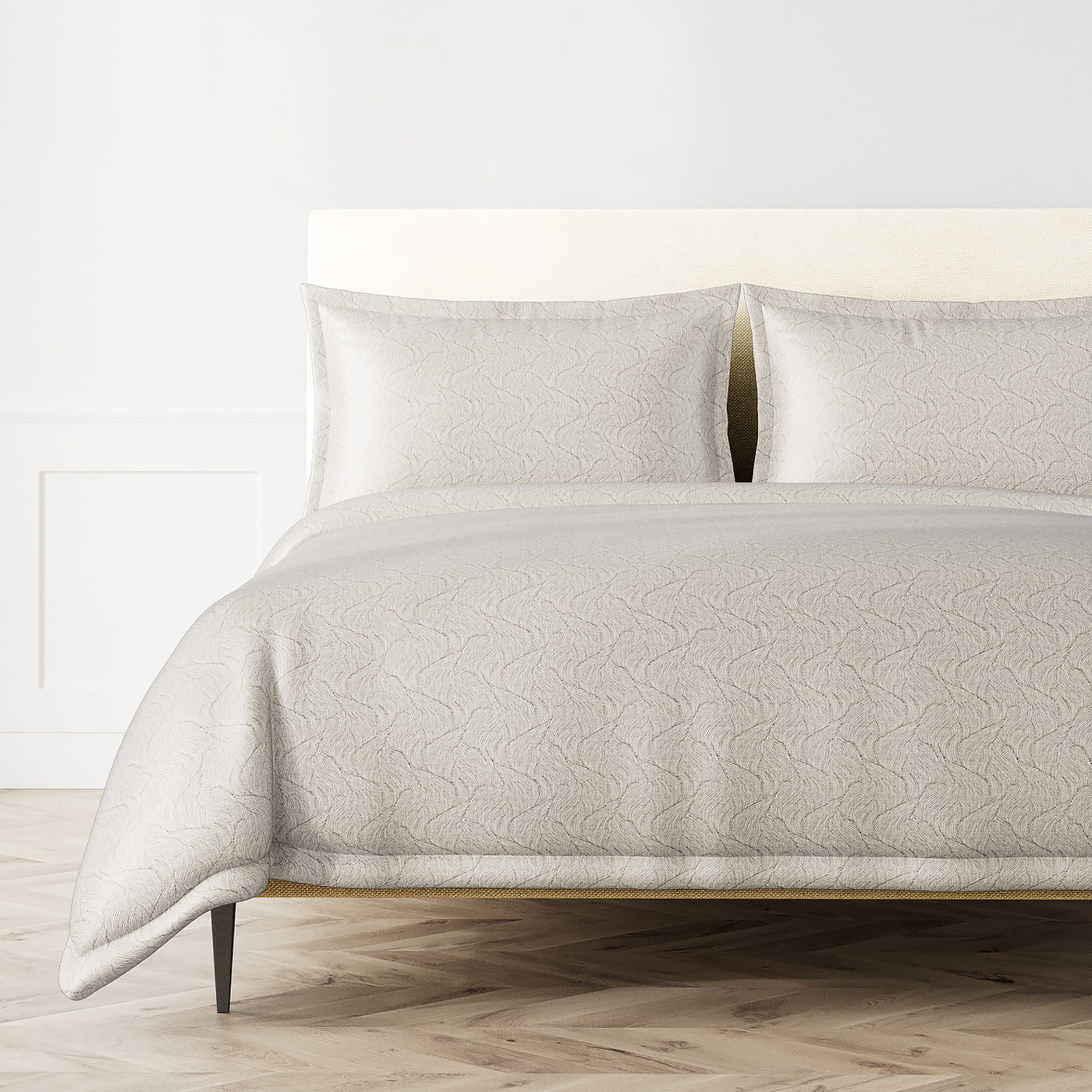 Ivory duvet set with tonal scallop pattern, styled on a bed with two matching shams.