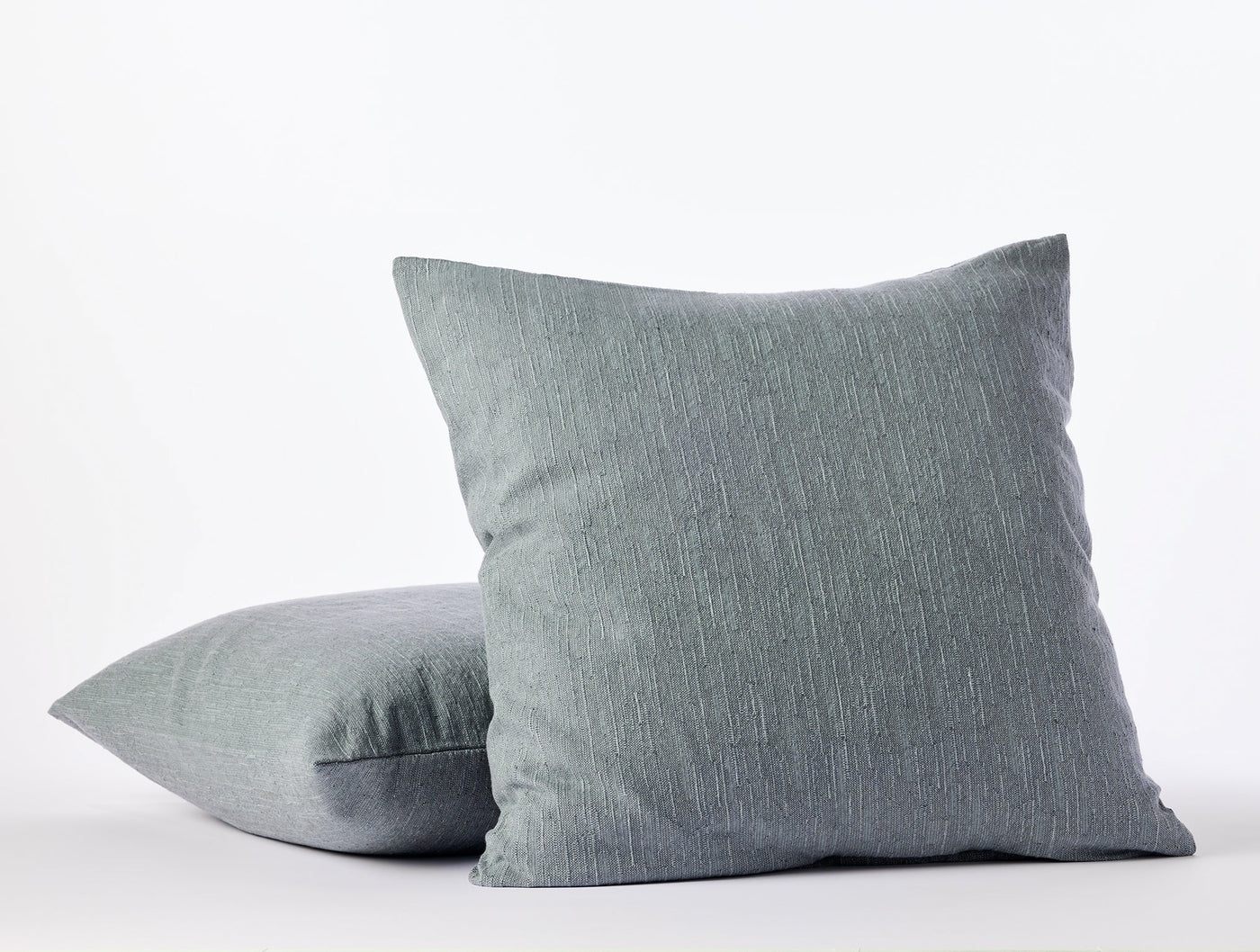 Two slate blue Coyuchi Toro Canyon shams stacked, showing subtle linen texture.