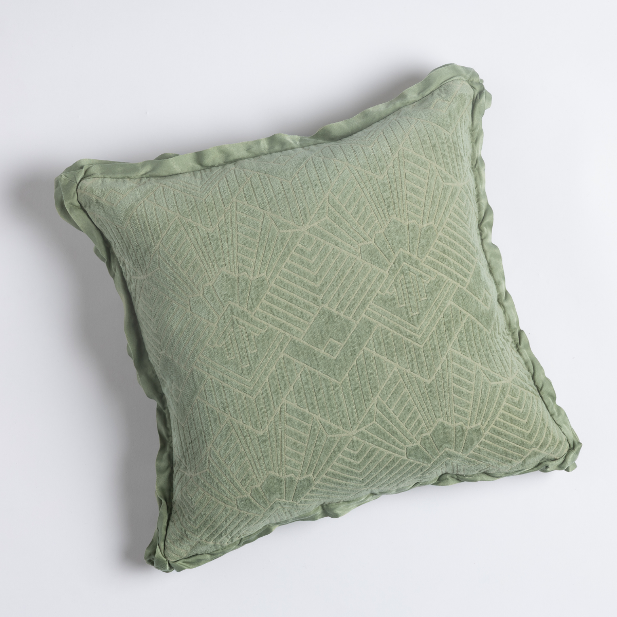 Trettino throw pillow in Desert Sage with tonal geometric jacquard pattern and ruffled edge trim.
