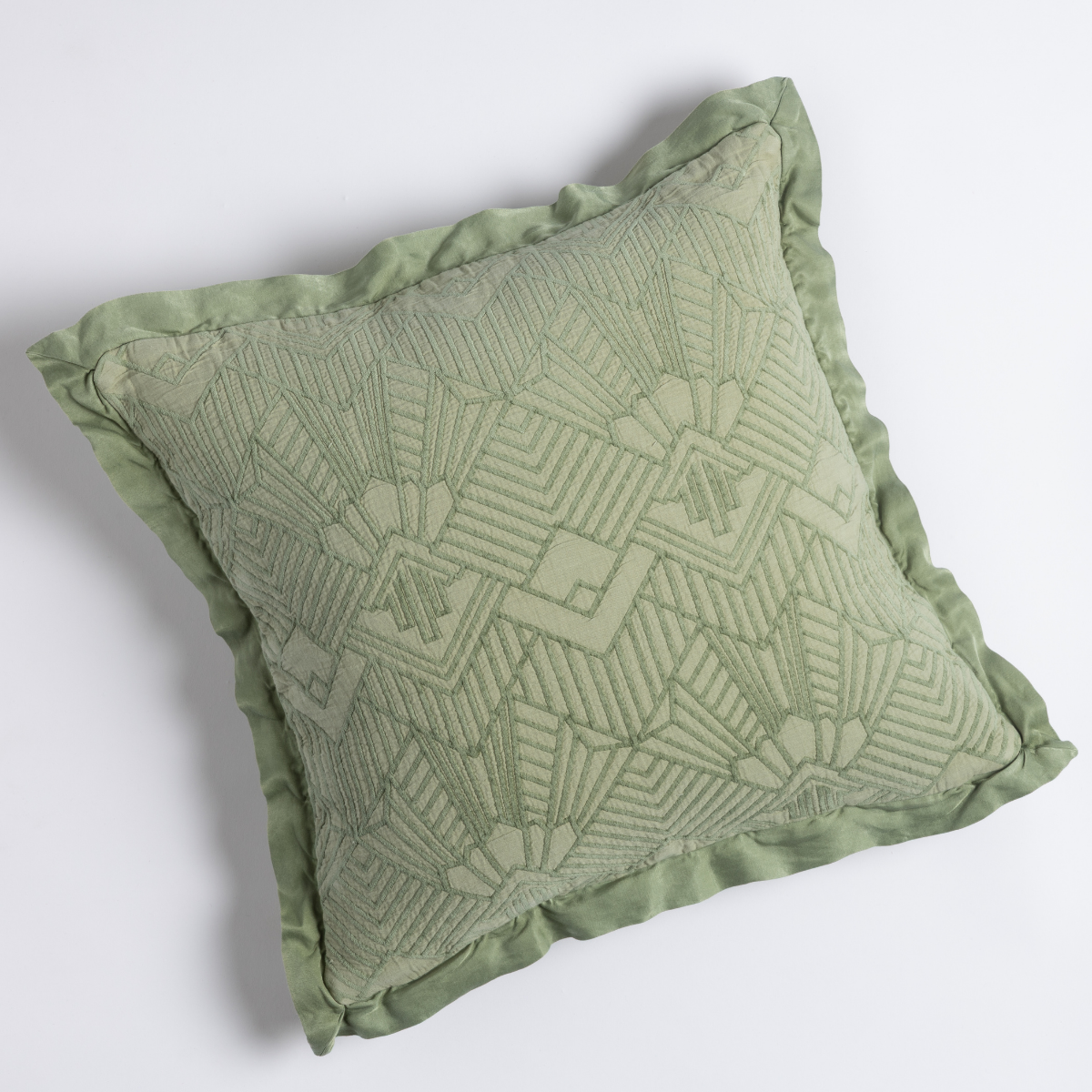 Ruffled edge detail on Bella Notte Trettino throw pillow in Desert Sage with geometric embroidery.