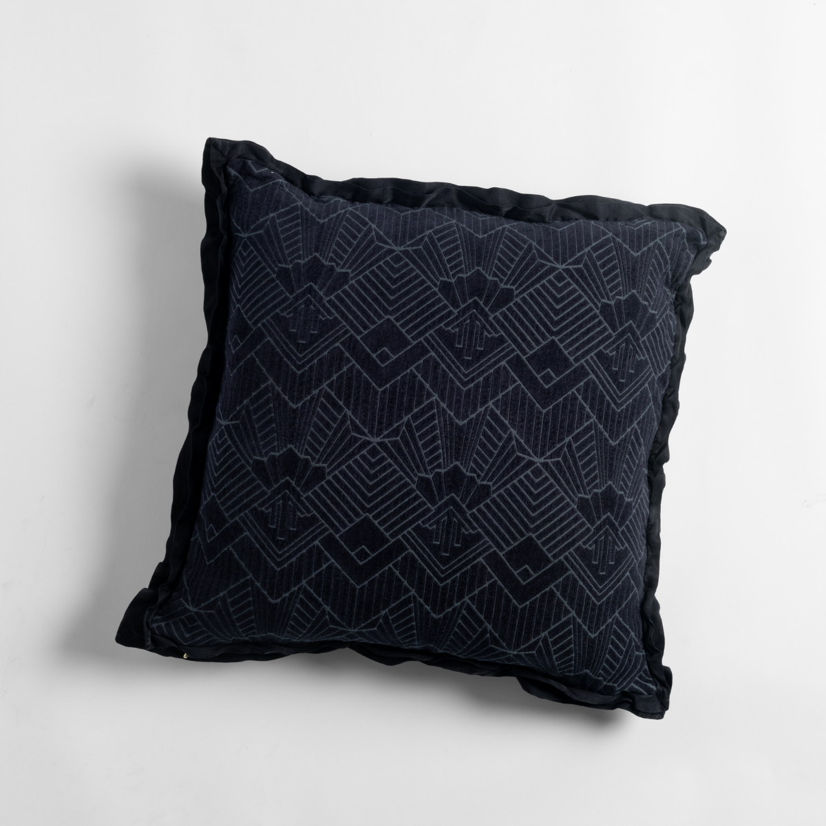 Bella Notte Trettino throw pillow in Slate with tonal geometric embroidery and ruffled trim.