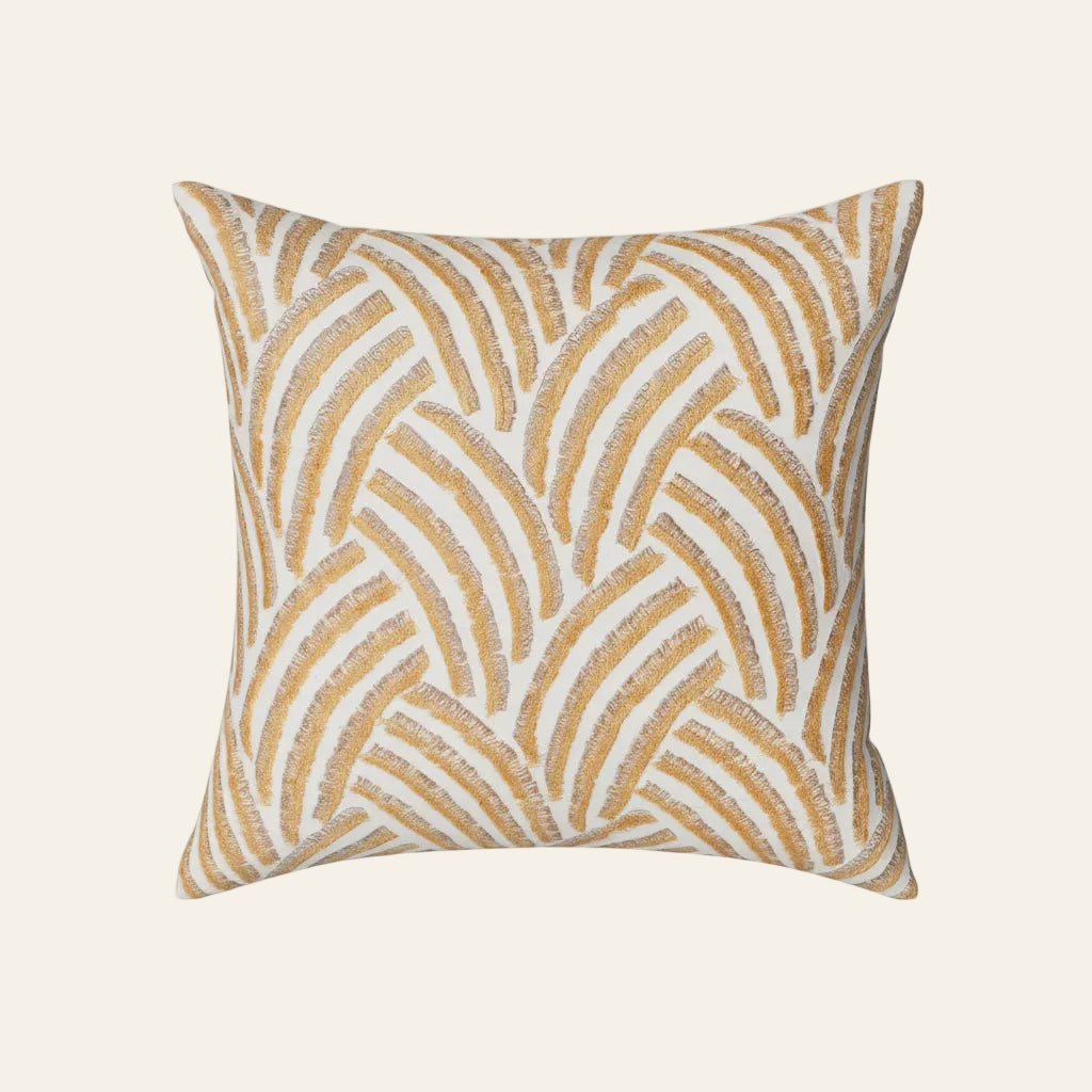 Ann Gish Trevi pillow in gold and ivory arched embroidery pattern on white ground.