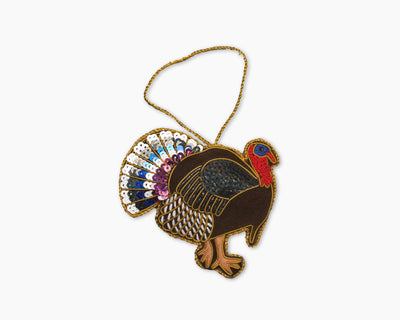 Henry Handwork turkey ornament with sequined multicolor tail feathers and gold cord hanger.