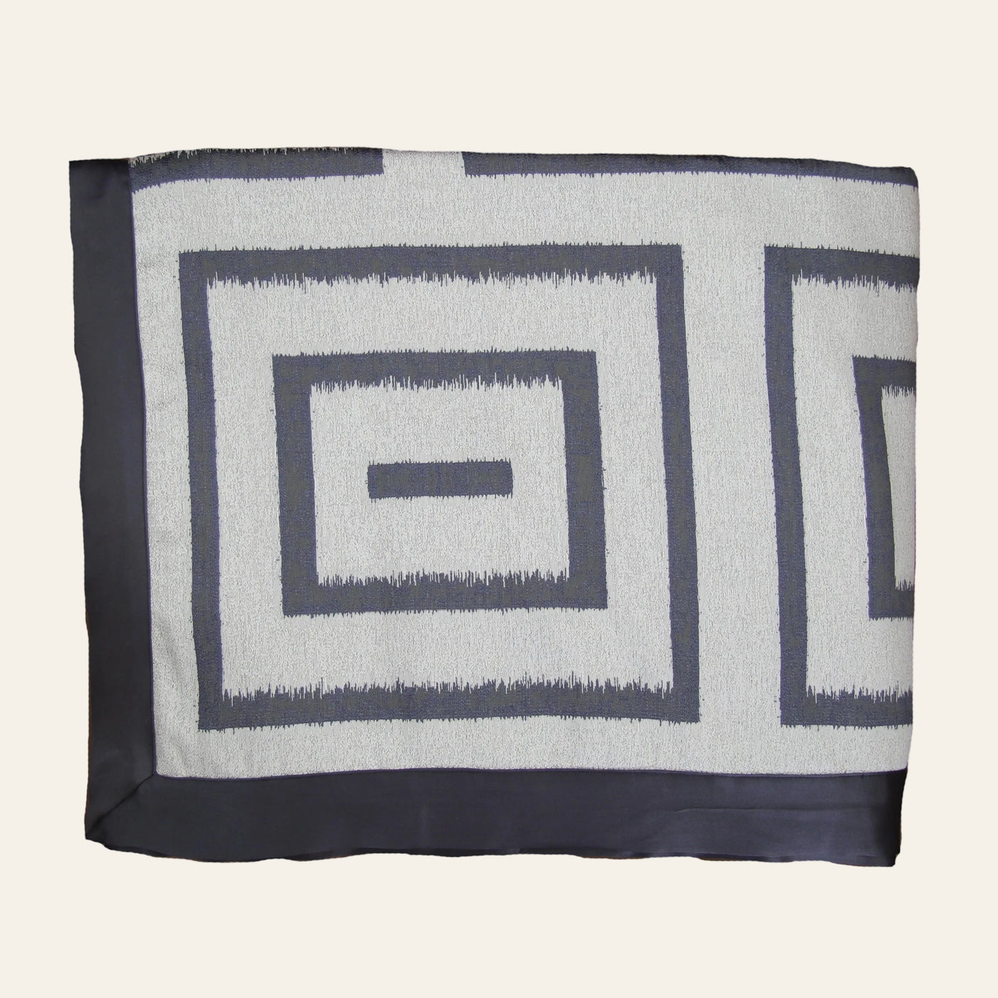 Ann Gish Unmazed duvet cover in charcoal and ivory with bold ikat square geometric pattern.
