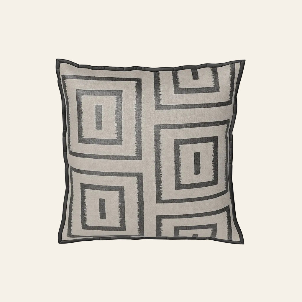 Ann Gish Unmazed sham in ivory with charcoal geometric maze embroidery and flanged edge.