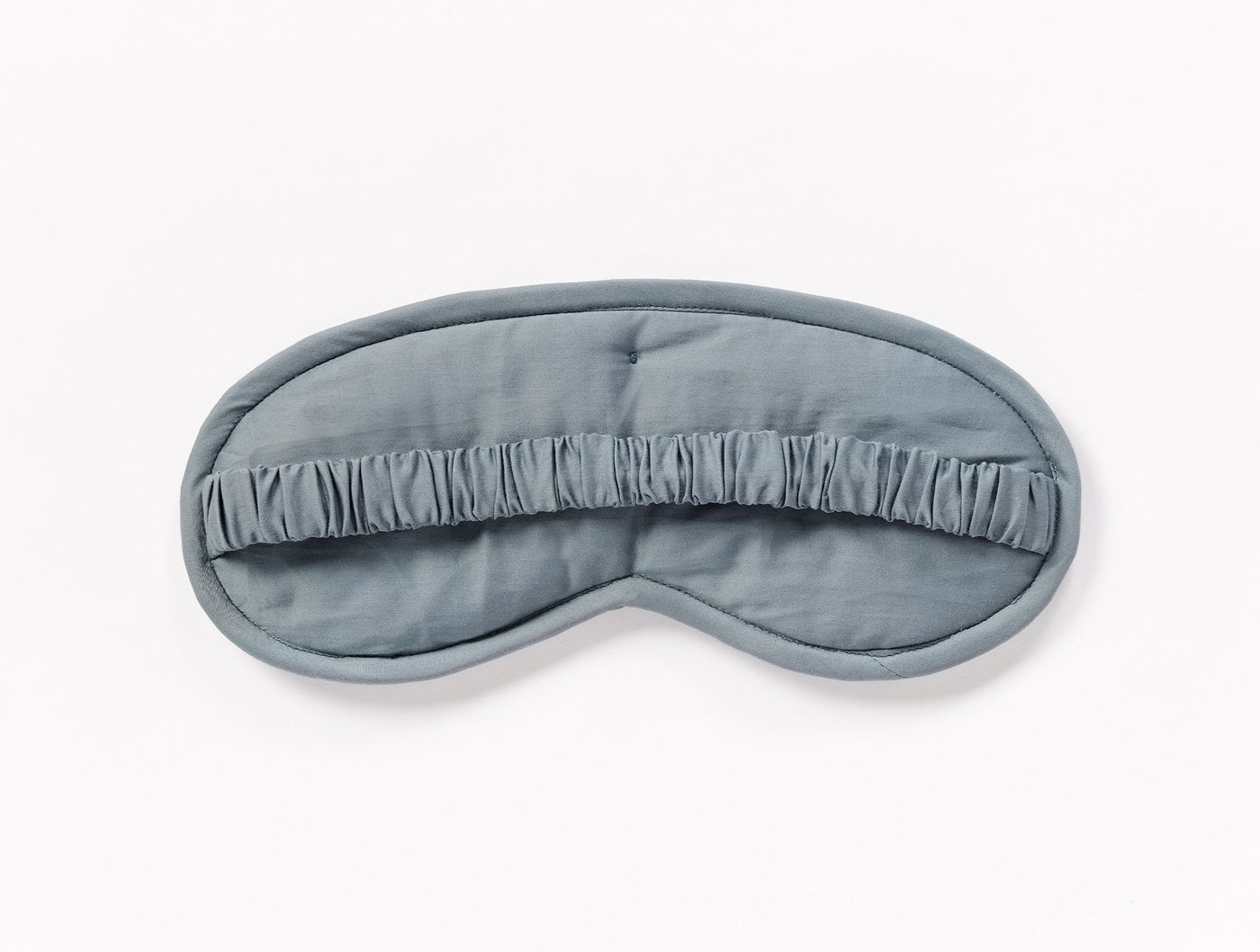 Coyuchi Cloud Soft Sateen eye mask in slate blue with gathered center panel detail.