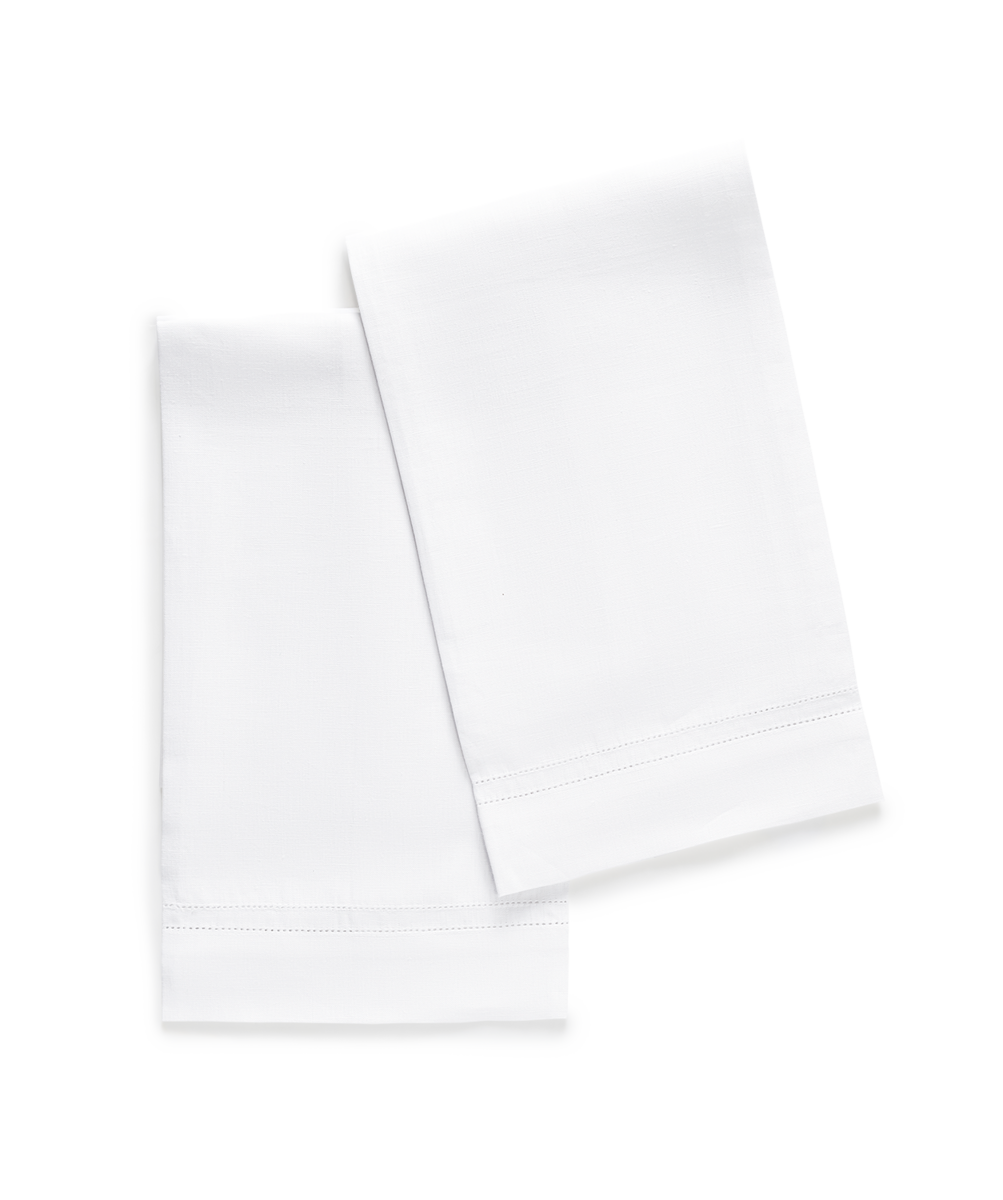 Two Valentina Hemstitch Guest Towels by Matouk, crafted from fine linen with elegant hems, are neatly folded and placed side by side on a plain light background.