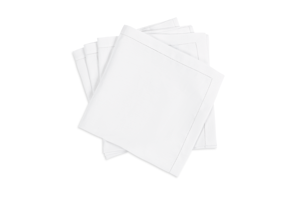 The Valentina Hemstitch Napkin Set by Matouk features four neatly stacked white linen napkins with elegant hemstitch borders, displayed on a white background—a refined touch for any upscale table setting.