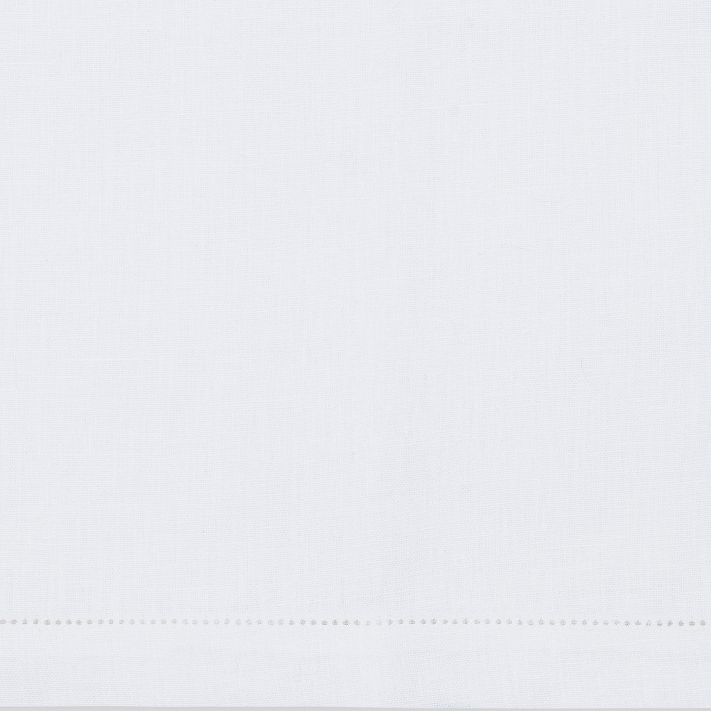 The Valentina Hemstitch Placemat Set by Matouk features plain white fabric with a refined hemstitch border, making it perfect for an elegant tabletop collection.