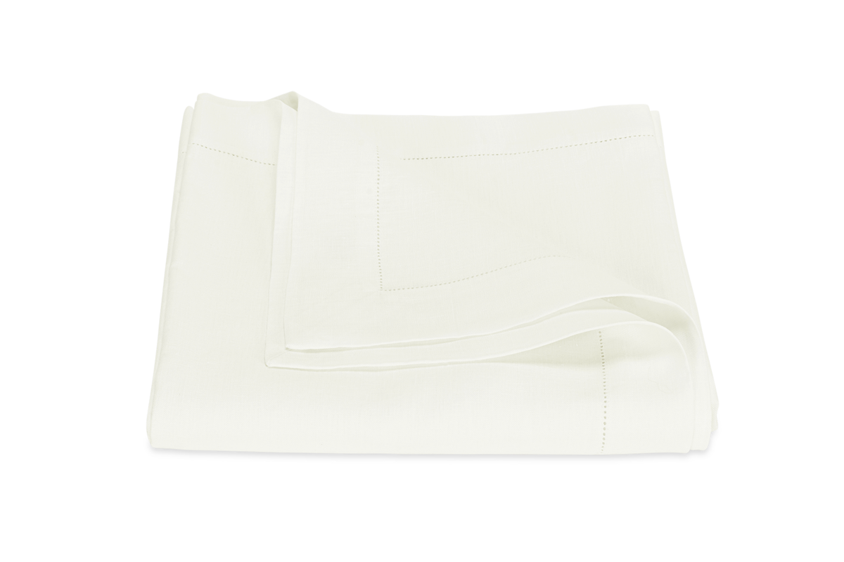 The Valentina Hemstitch Tablecloth by Matouk is a neatly folded, plain white cloth with a classic hemstitch border, displayed on a white background.