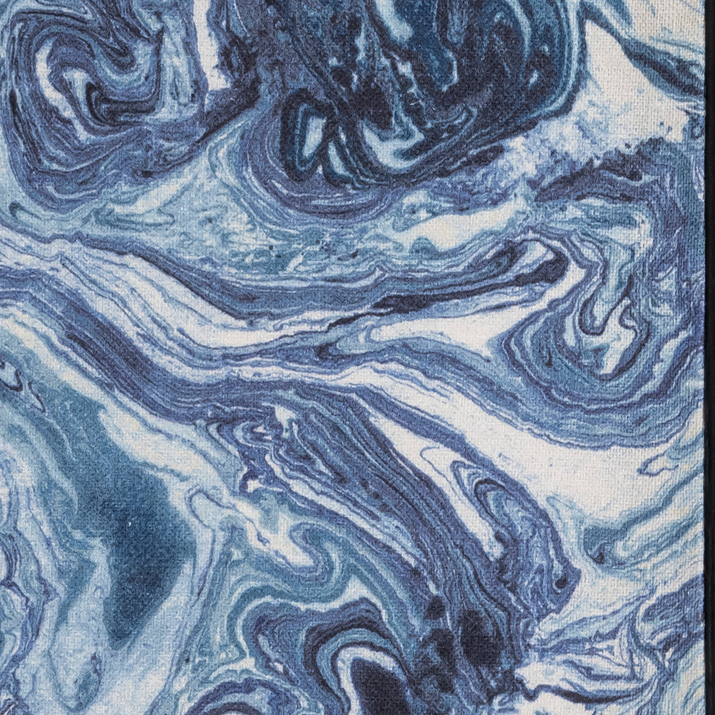 Close-up of indigo and ivory marbled linen fabric on Valentina sleep mask.