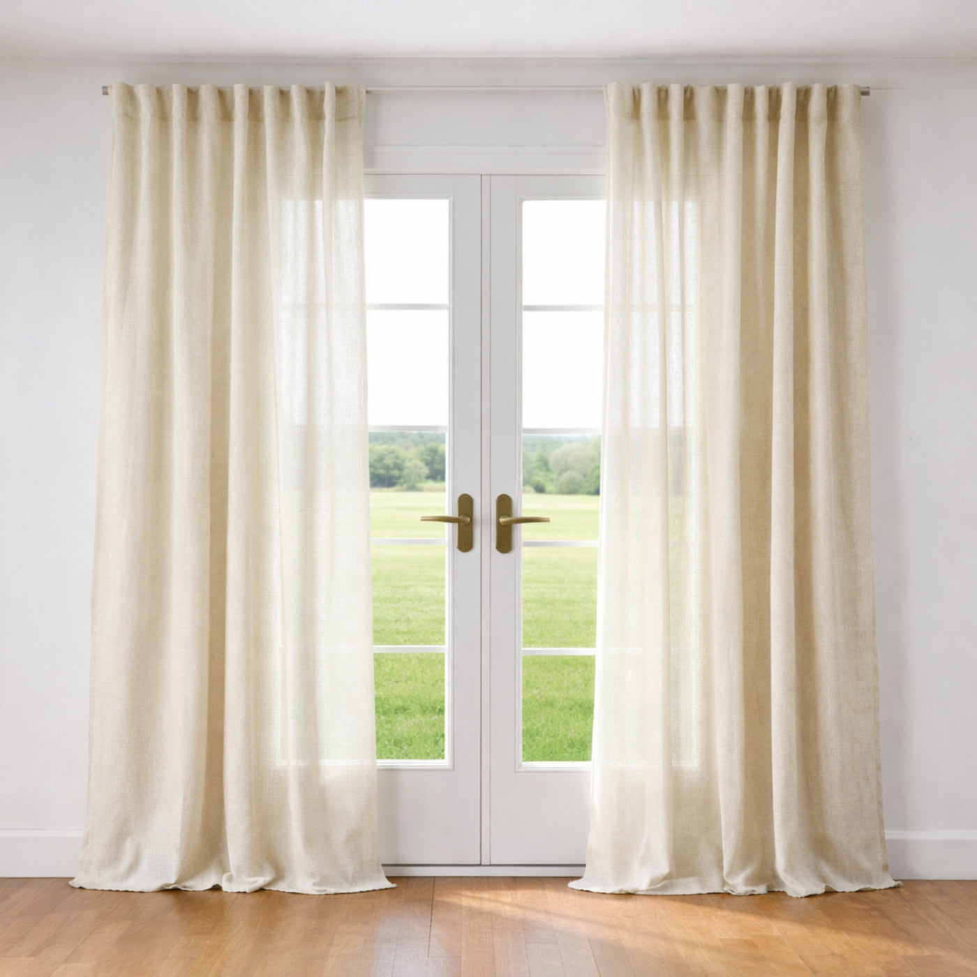 Ann Gish Veil curtain panels in ivory linen, floor-length drape framing French doors.