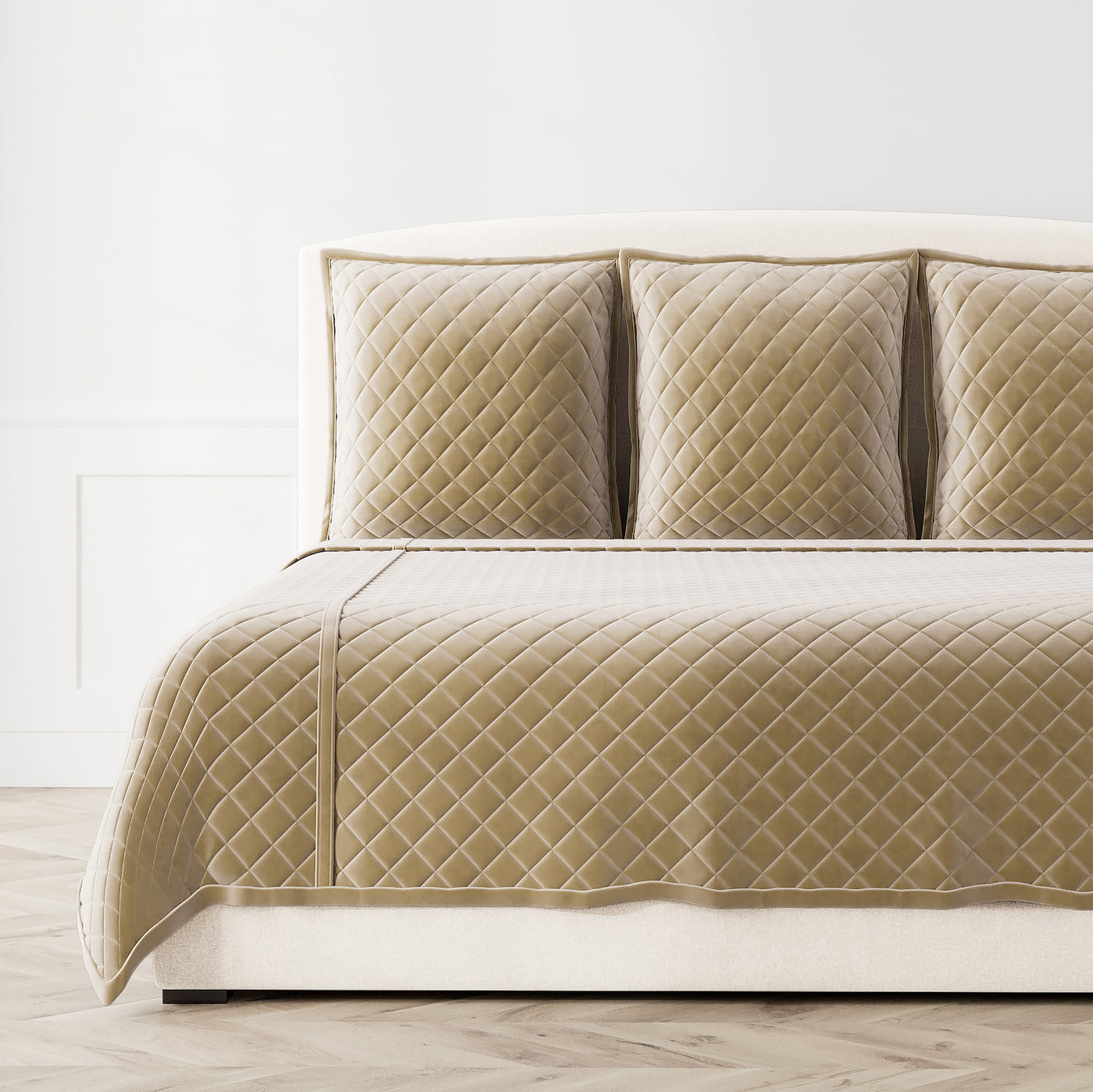Champagne velvet coverlet set with diamond quilting, styled on a bed with matching shams.