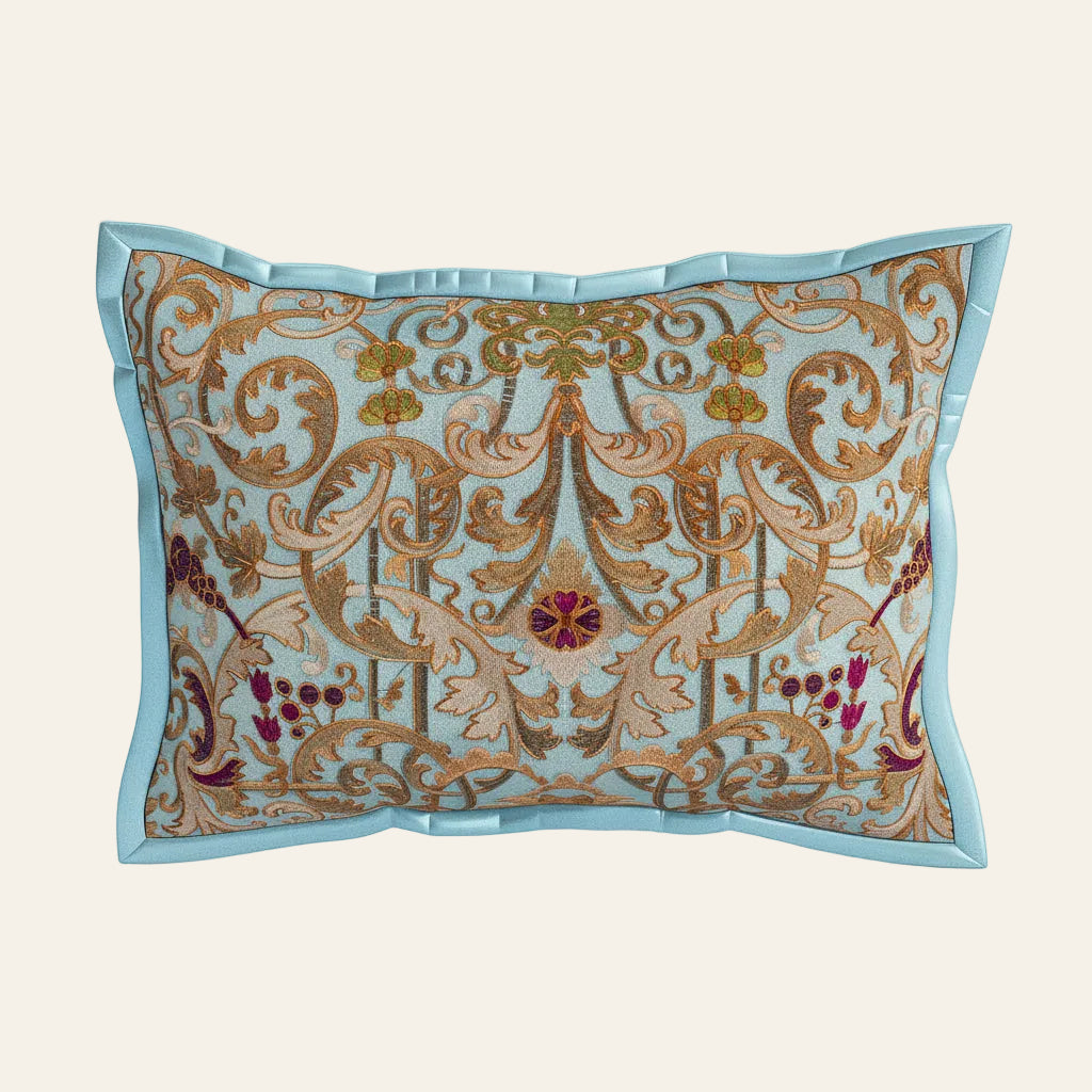 Ann Gish Venezia pillow in sky blue with ornate gold baroque embroidery and floral accents.
