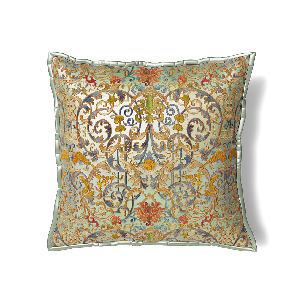 Ann Gish Venezia pillow with ornate gold and multicolor baroque scrollwork on sage ground.