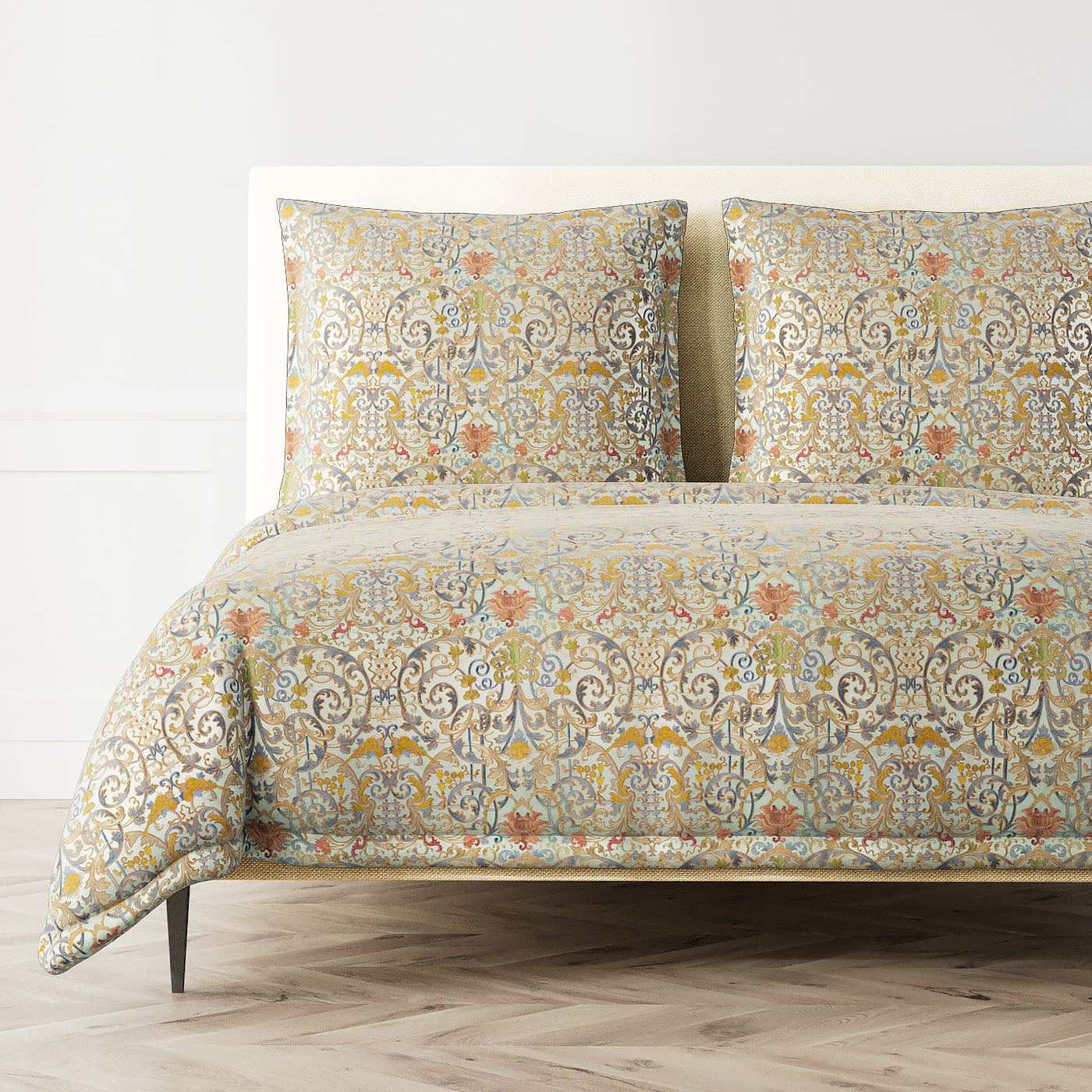 Venezia duvet cover and shams styled on a bed, showing full multicolor damask pattern.