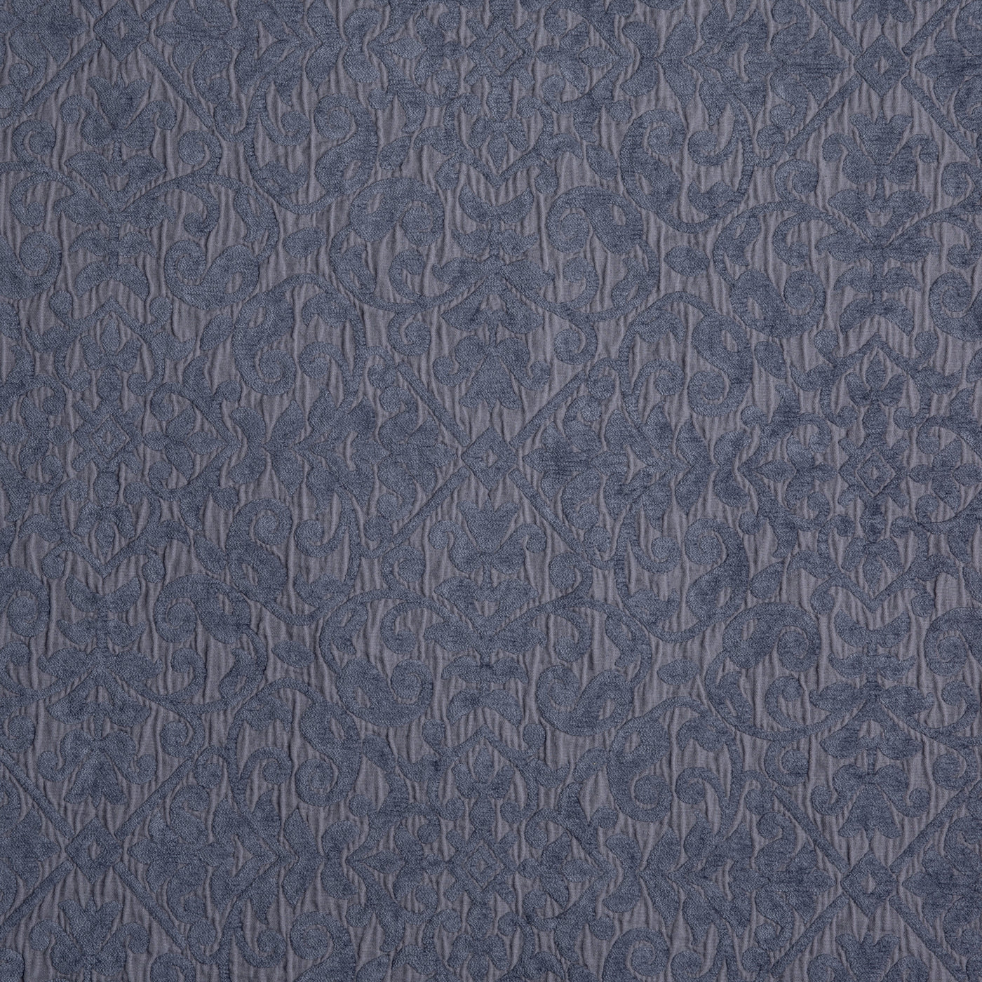 Close-up of Vienna coverlet in French Lavender, tonal damask quilted pattern on soft fabric.