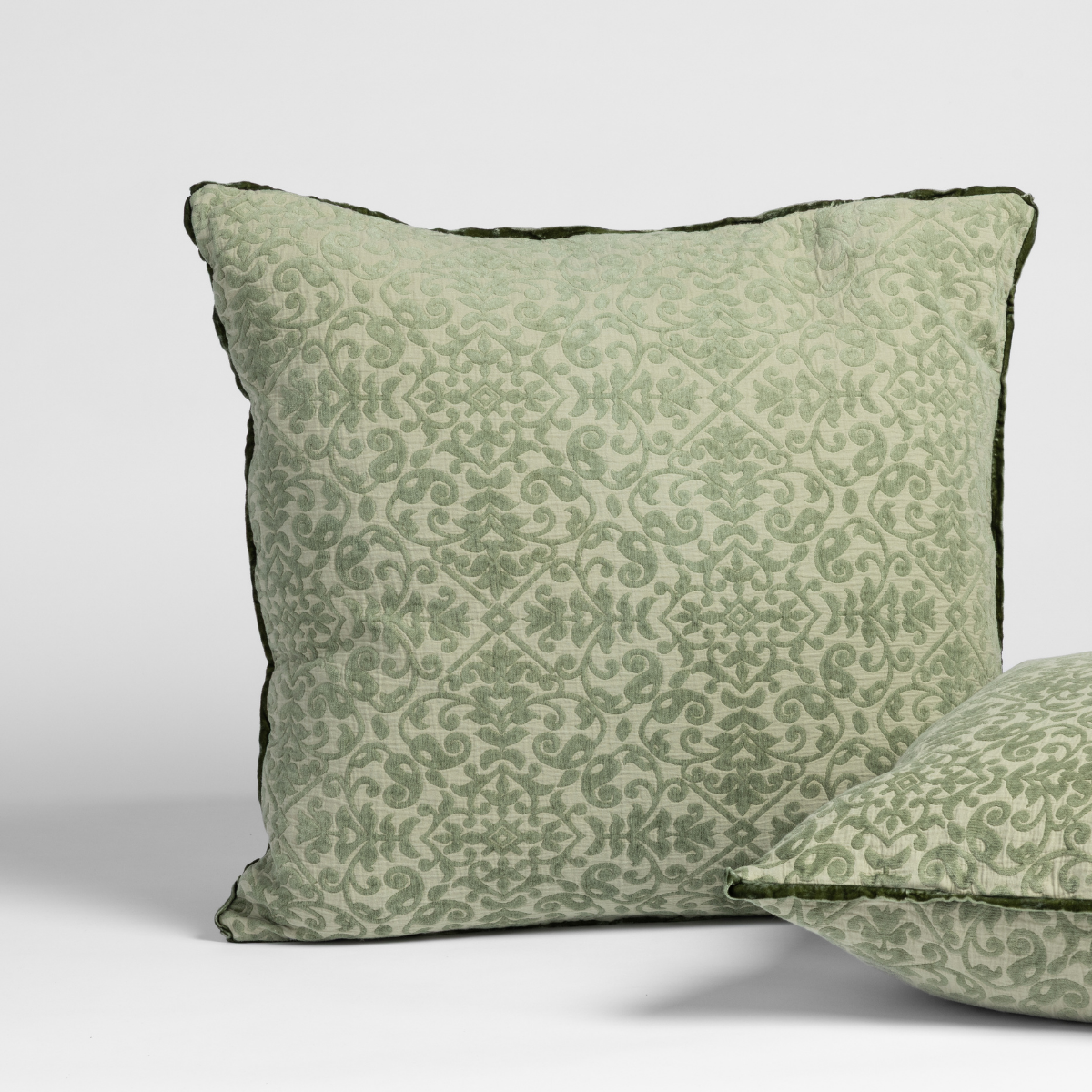 Bella Notte Vienna sham in Desert Sage, showing damask pattern and dark piped edge trim.
