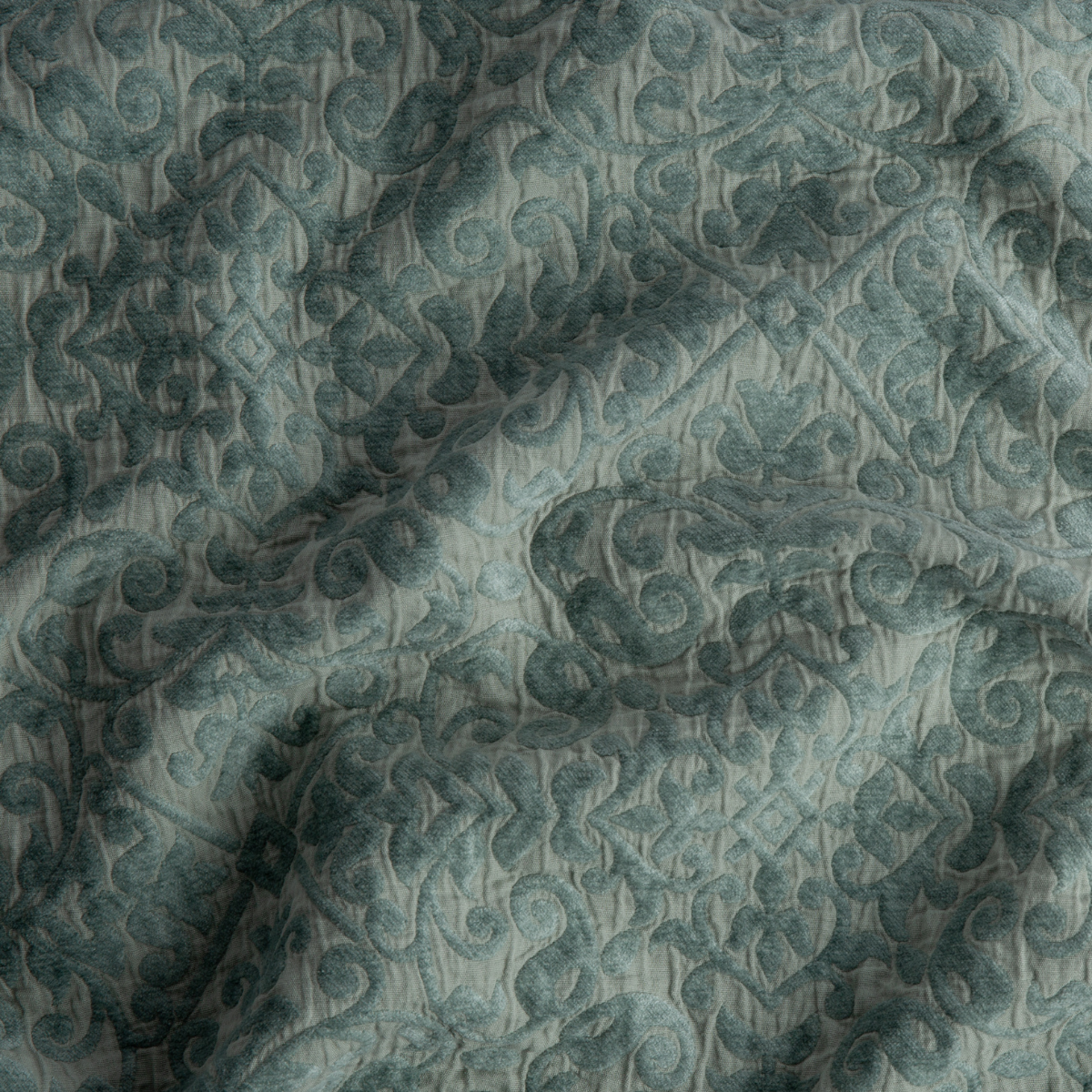 Close-up of Bella Notte Vienna coverlet in Eucalyptus, showing quilted damask pattern with tonal scrollwork.