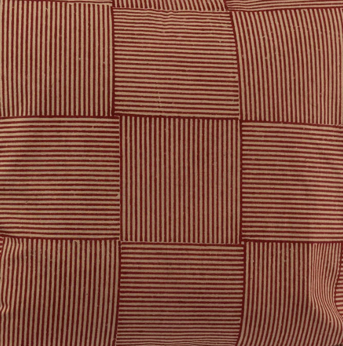 Close-up of crimson and sand alternating striped block weave textile pattern.