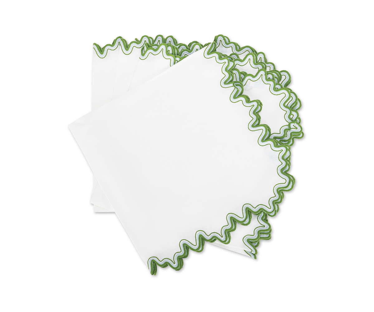 Matouk's Wave | Napkin features three elegant linen napkins with green wavy embroidered edges, stacked on a white background—perfect for elevating any dining space.