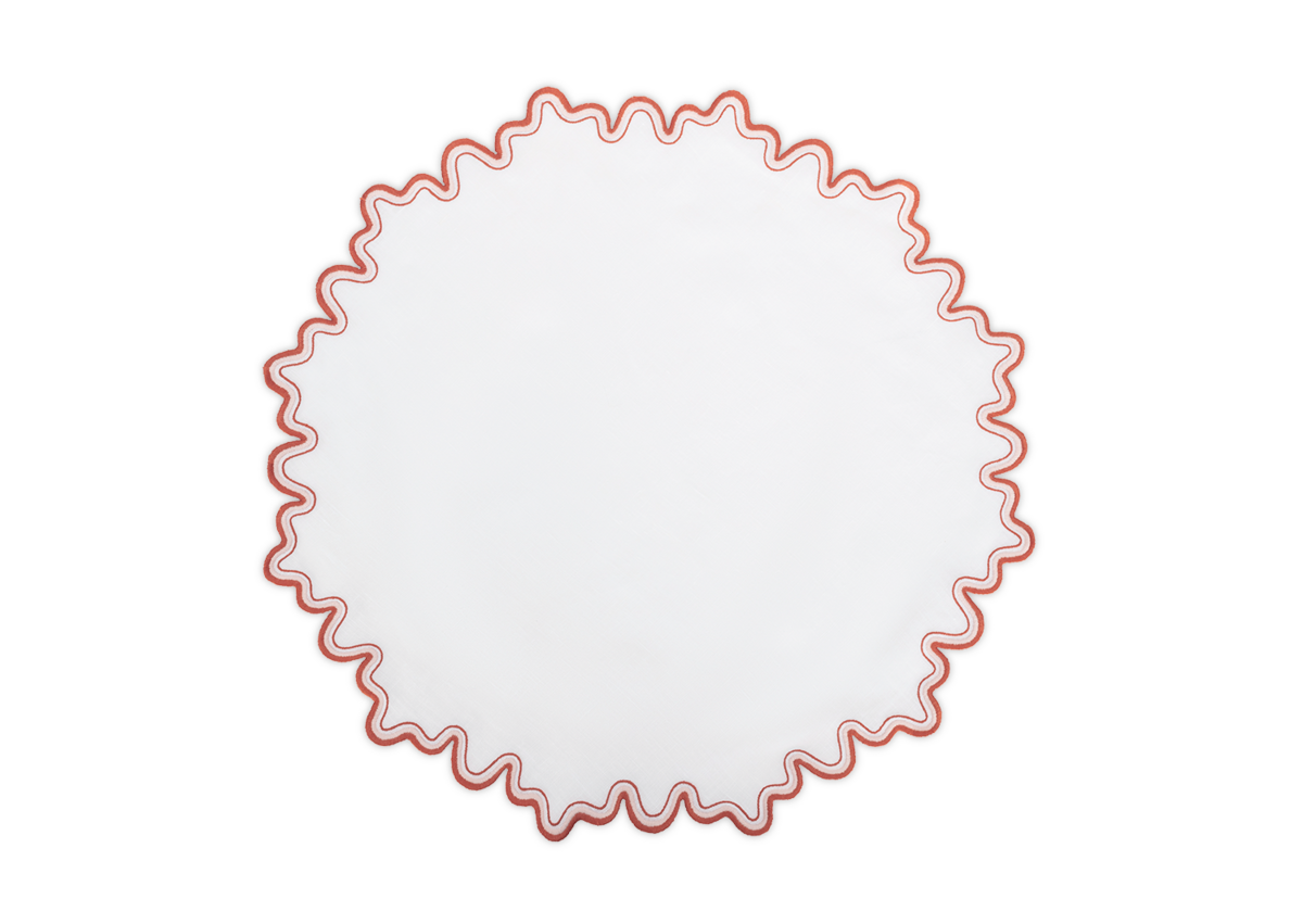 The Matouk Wave Placemat is a round, white linen placemat featuring a two-tone wavy red embroidered border, shown on a plain white background.