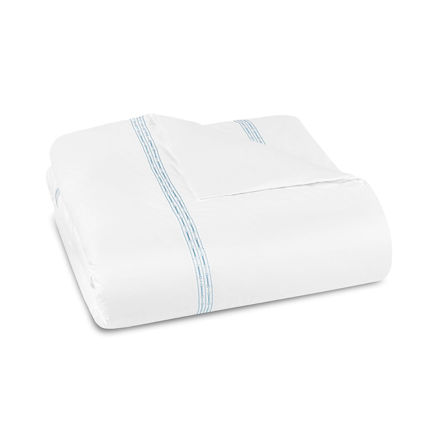 The Memoria Duvet Cover, made in Portugal, features elegant blue stitched lines near the edges and fine embroidery, displayed neatly folded on a plain white background.