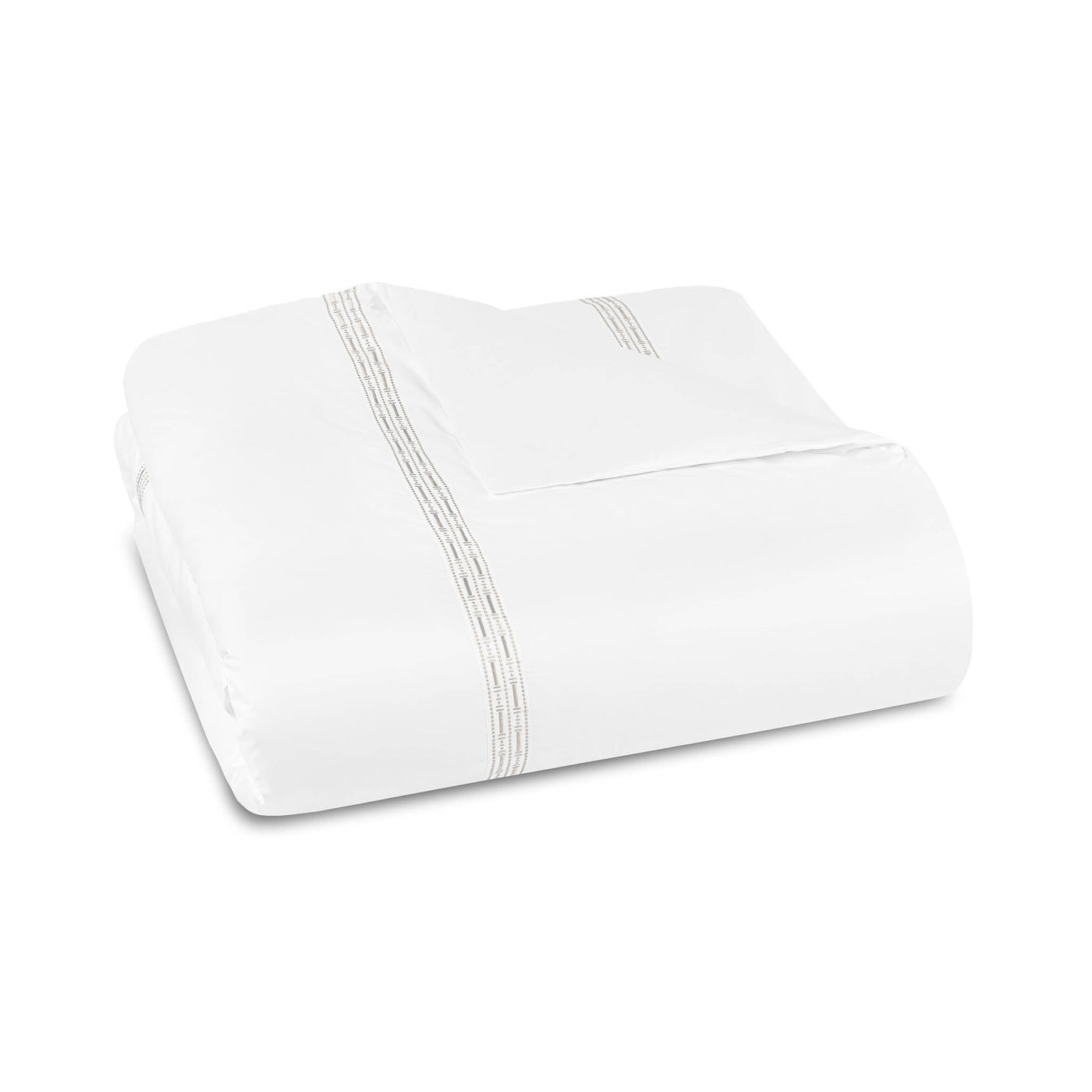 The Memoria Duvet Cover, made in Portugal, is a white bedsheet set with delicate grey or silver embroidery near the edges, neatly folded and displayed on a plain white background.