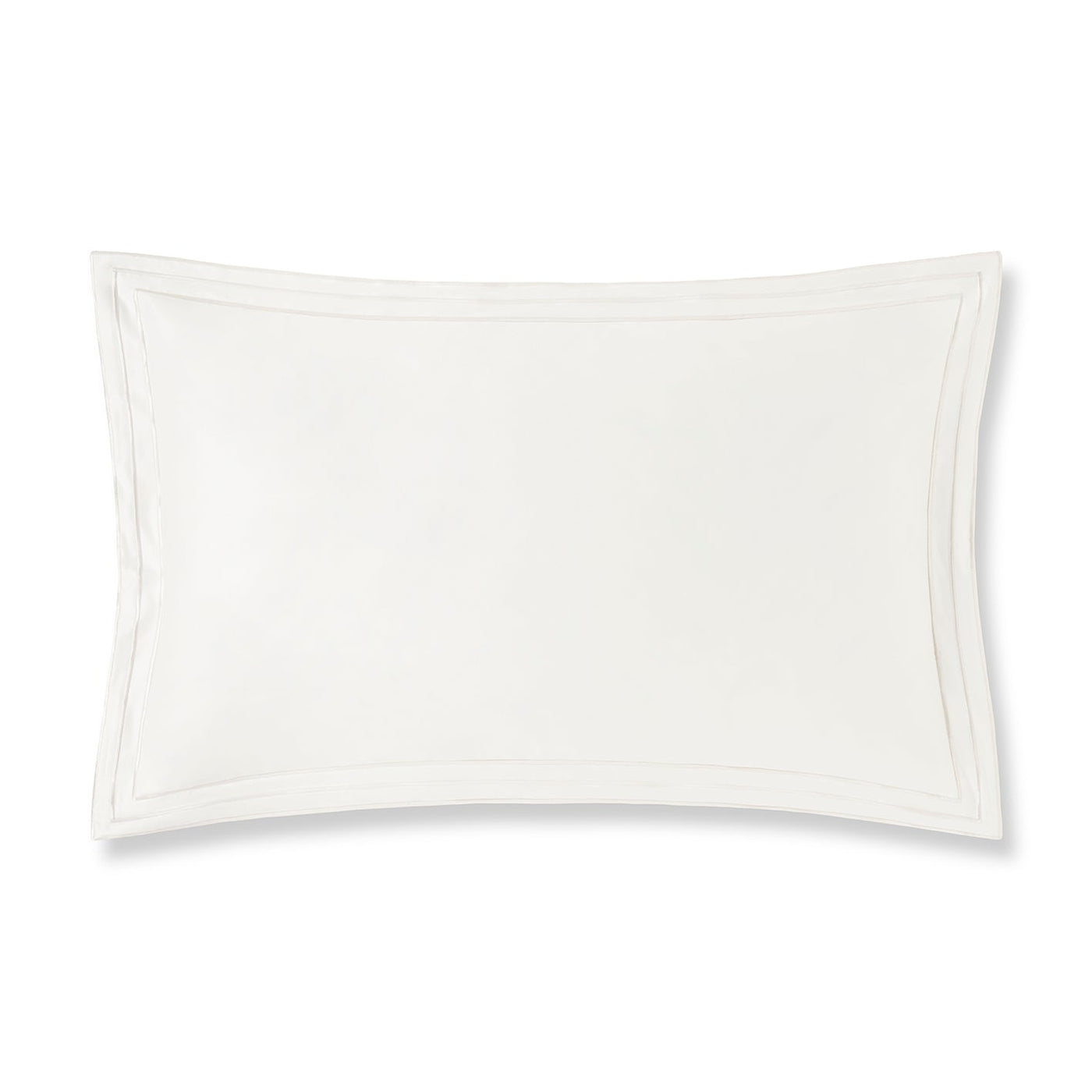 Close-up of ivory cotton pillow sham with tonal double-stitch border detail.