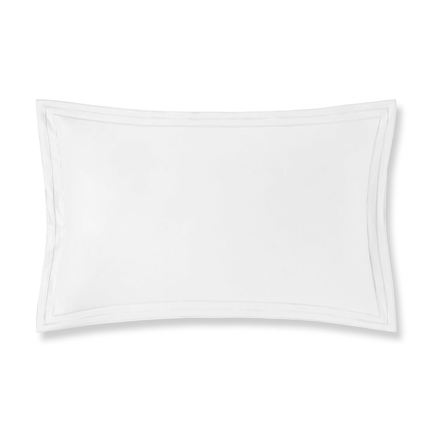 Flat lay detail of white pillow sham with double-row embroidered border trim.