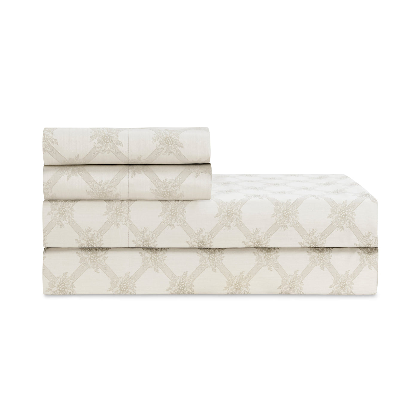 Close-up of folded Alexandra sheet set showing ivory cotton with champagne geometric lattice and starburst print.